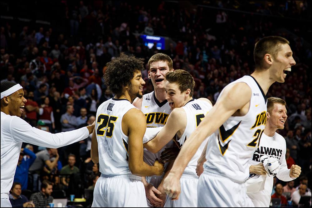  Iowa’s Adam Woodbury (34) celebrates after hitting the game winning shot to put the Hawkeyes up 72-70 in overtime of their first round NCAA championship game on Friday, March 18, 2016 in New York City,New York.during their first round NCAA champions