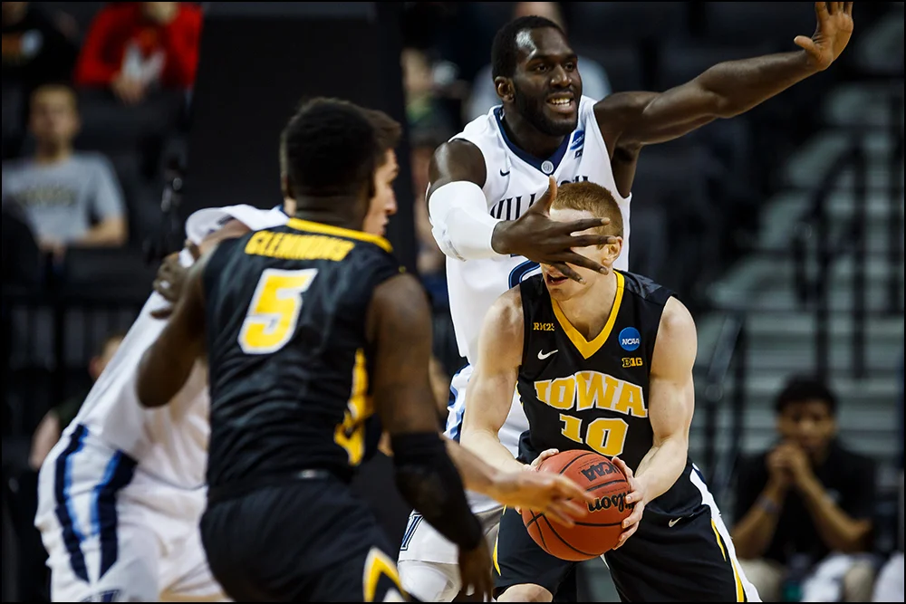 Iowa’s Mike Gesell (10) is blocked during their second round NCAA Basketball Championship game on Sunday, March 20, 2016 in New York City, New York.