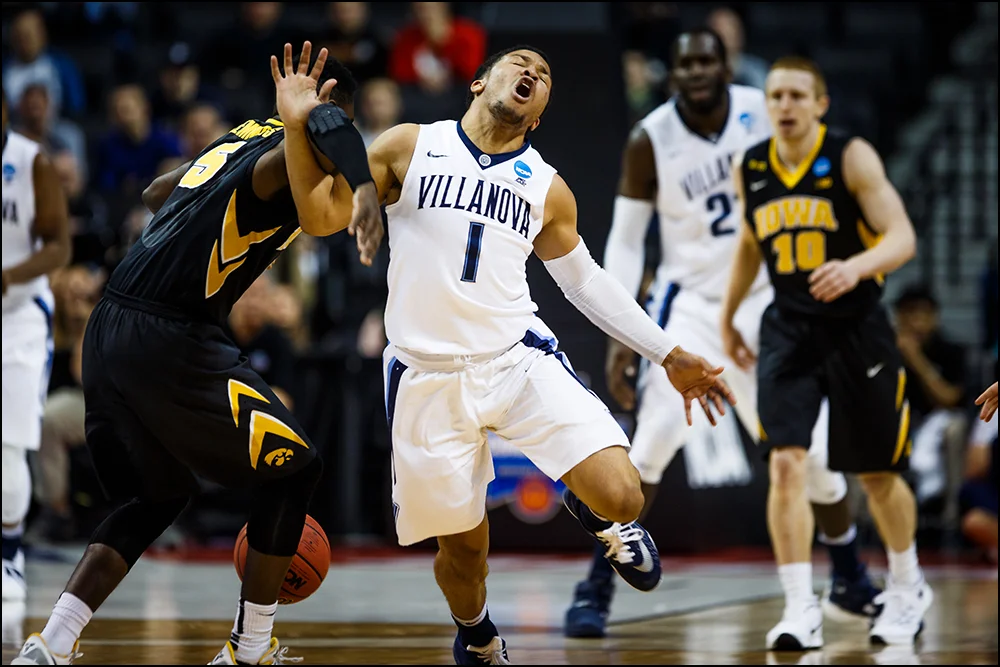 Iowa’s Anthony Clemmons (5) fouls Villanova's Jalen Brunson during their second round NCAA Basketball Championship game on Sunday, March 20, 2016 in New York City, New York.