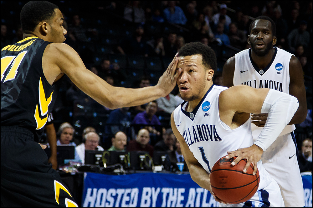 Iowa’s Christian Williams (11) defends Villanova's Jalen Brunson during their second round NCAA Basketball Championship game on Sunday, March 20, 2016 in New York City, New York. 