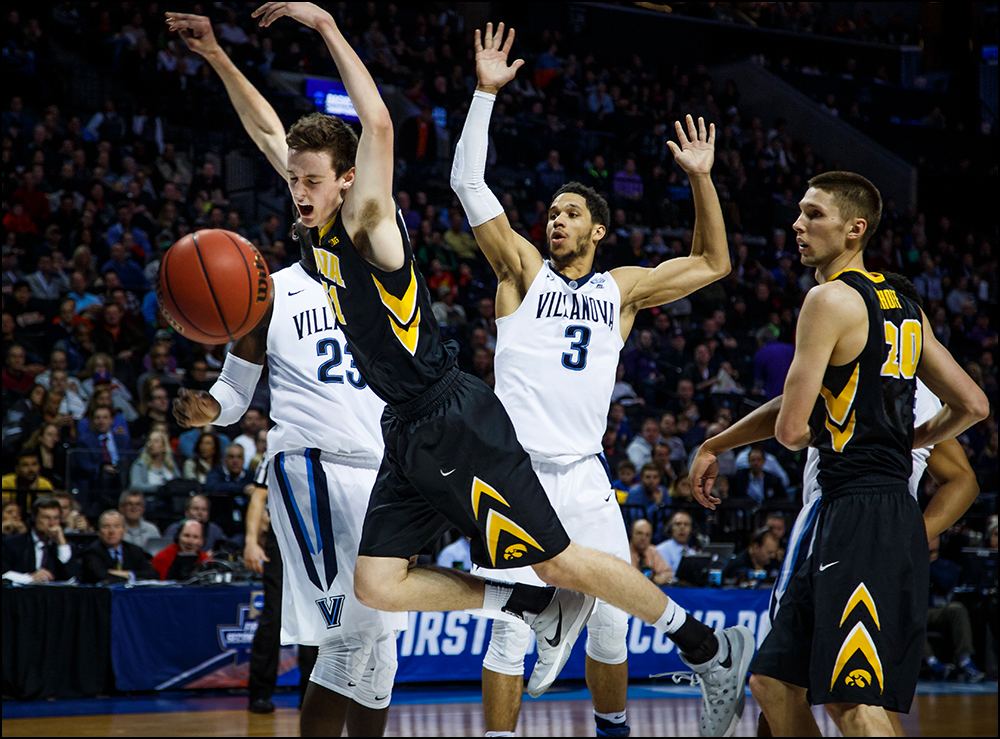  Iowa’s Nicholas Baer (51) is fouled on his way to the basket during their second round NCAA Basketball Championship game on Sunday, March 20, 2016 in New York City, New York. Villanova would go on to win 87-68. 