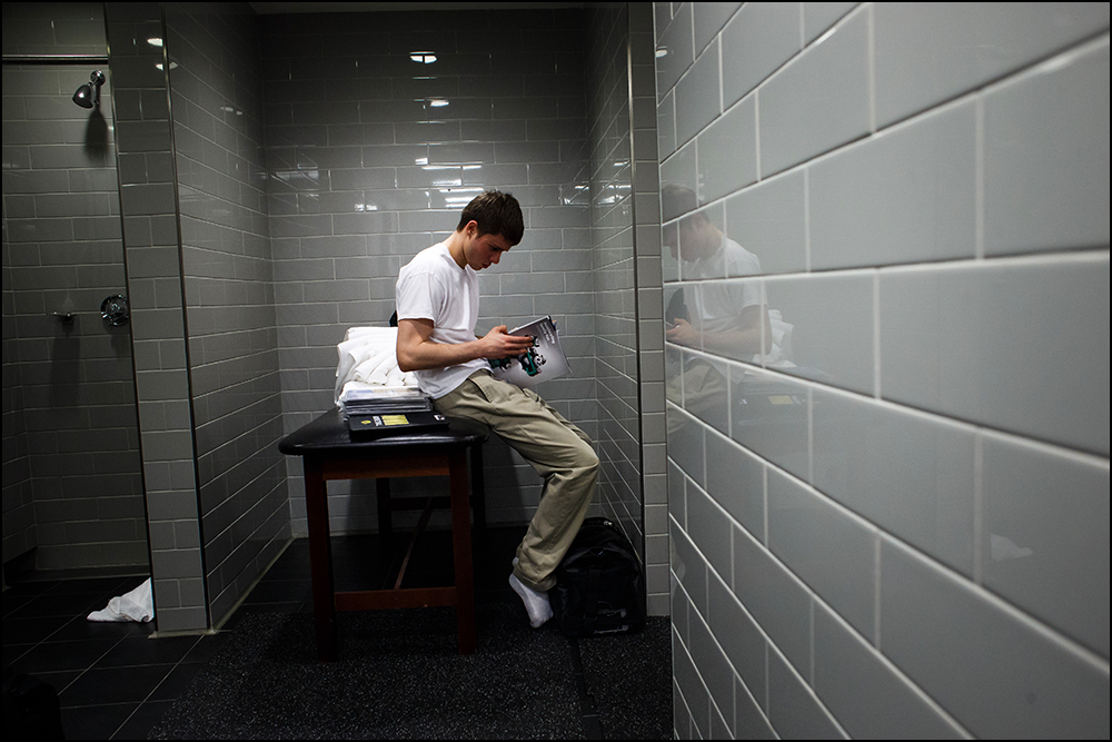  Iowa’s Michael Soukup (3) hangs out in the locker room and media members talk to the team following their 87-68 loss to Villanova during their second round NCAA Basketball Championship game on Sunday, March 20, 2016 in New York City, New York. 