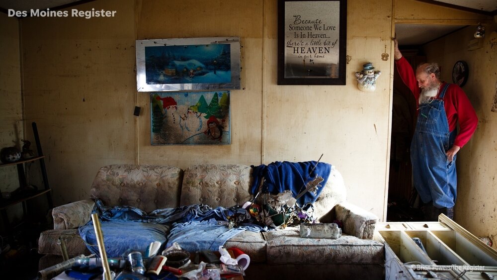  Danny Manchester, 69, hangs his head on his arm as he stands in what was the living room of the trailer he and his wife Mary lived in since 1993 on Tuesday, April 16, 2019, in Pacific Junction. The flooding along the Missouri river in late March bro