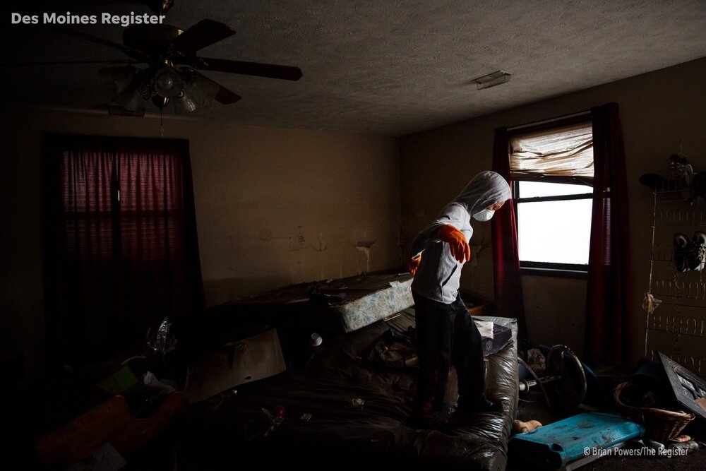  Jaden Hill, 10, stands on a bed as he helps his dad Paul begins the cleanup process at the Bluff View Motel on Wednesday, April 3, 2019, in Pacific Junction. The Hills have lived in and run the motel for the last ten years but are unsure they will r