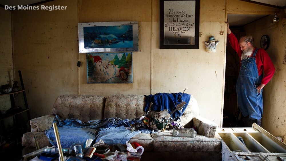  Danny Manchester, 69, hangs his head on his arm as he stands in what was the living room of the trailer he and his wife Mary lived in since 1993 on Tuesday, April 16, 2019, in Pacific Junction. The flooding along the Missouri river in late March bro