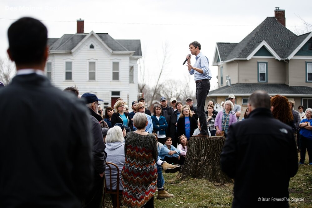  People listen as 2020 Democratic presidential candidate and former Texas Representative Beto O'Rourke stands onto a stump to give his speech in Marshalltown at the Mowry Irvine Mansion during a swing though Iowa on Friday, April 5, 2019, in Marshall