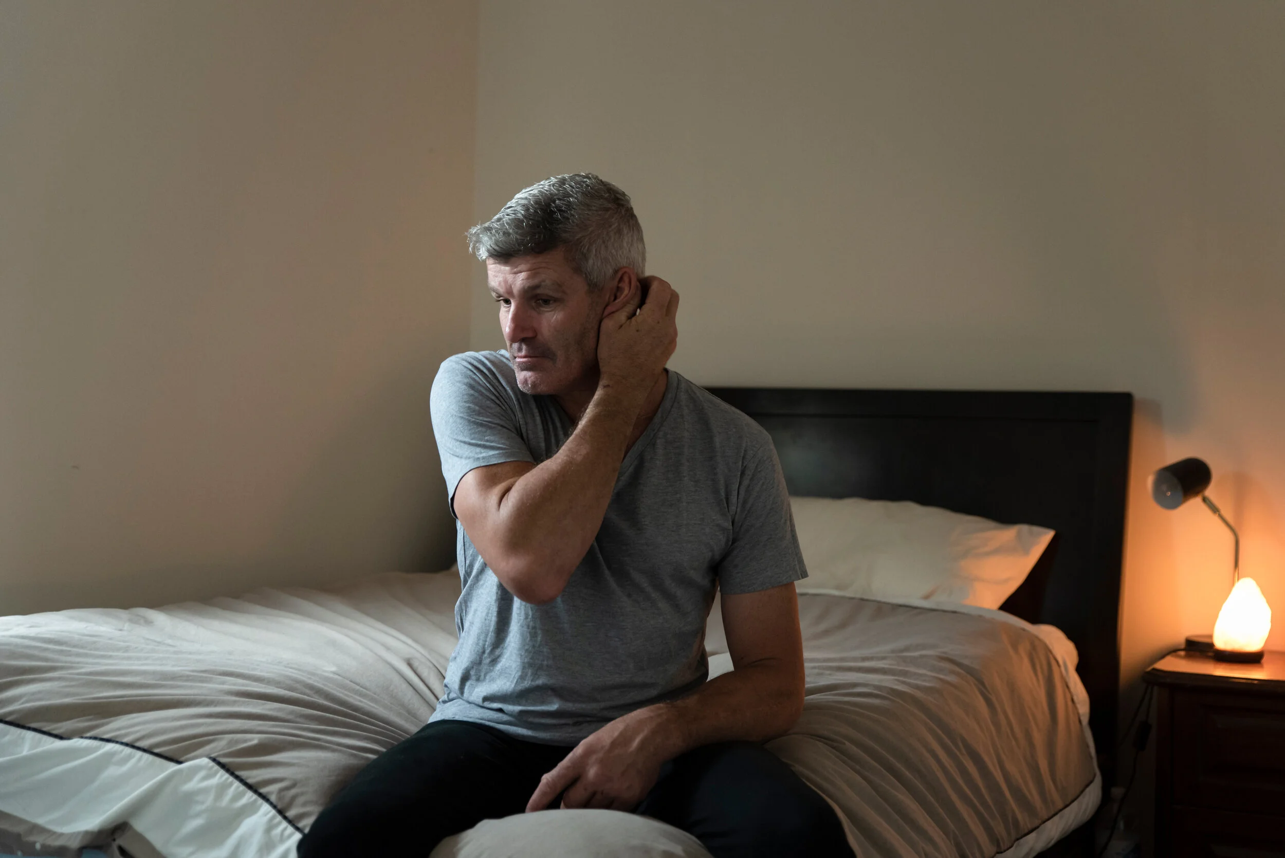 Portrait of Shaun Smith, 50, one of several retired AFL player suffering significant mental health challenges following multiple concussions in his playing years.