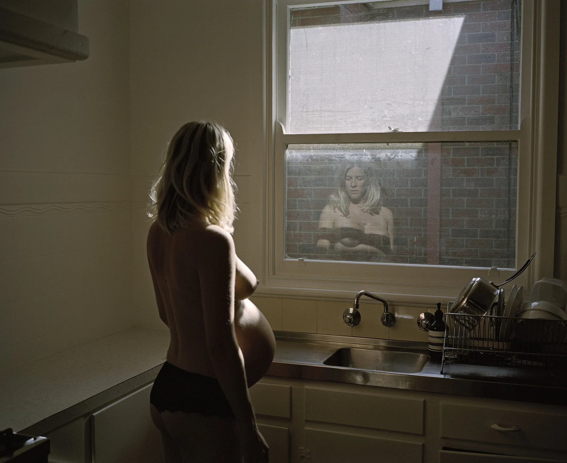 Greta in her kitchen, 36 weeks. Winner, National Photographic Portrait Prize 2019