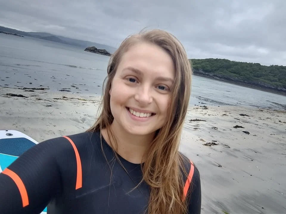 Becky with her paddleboard in Glenuig