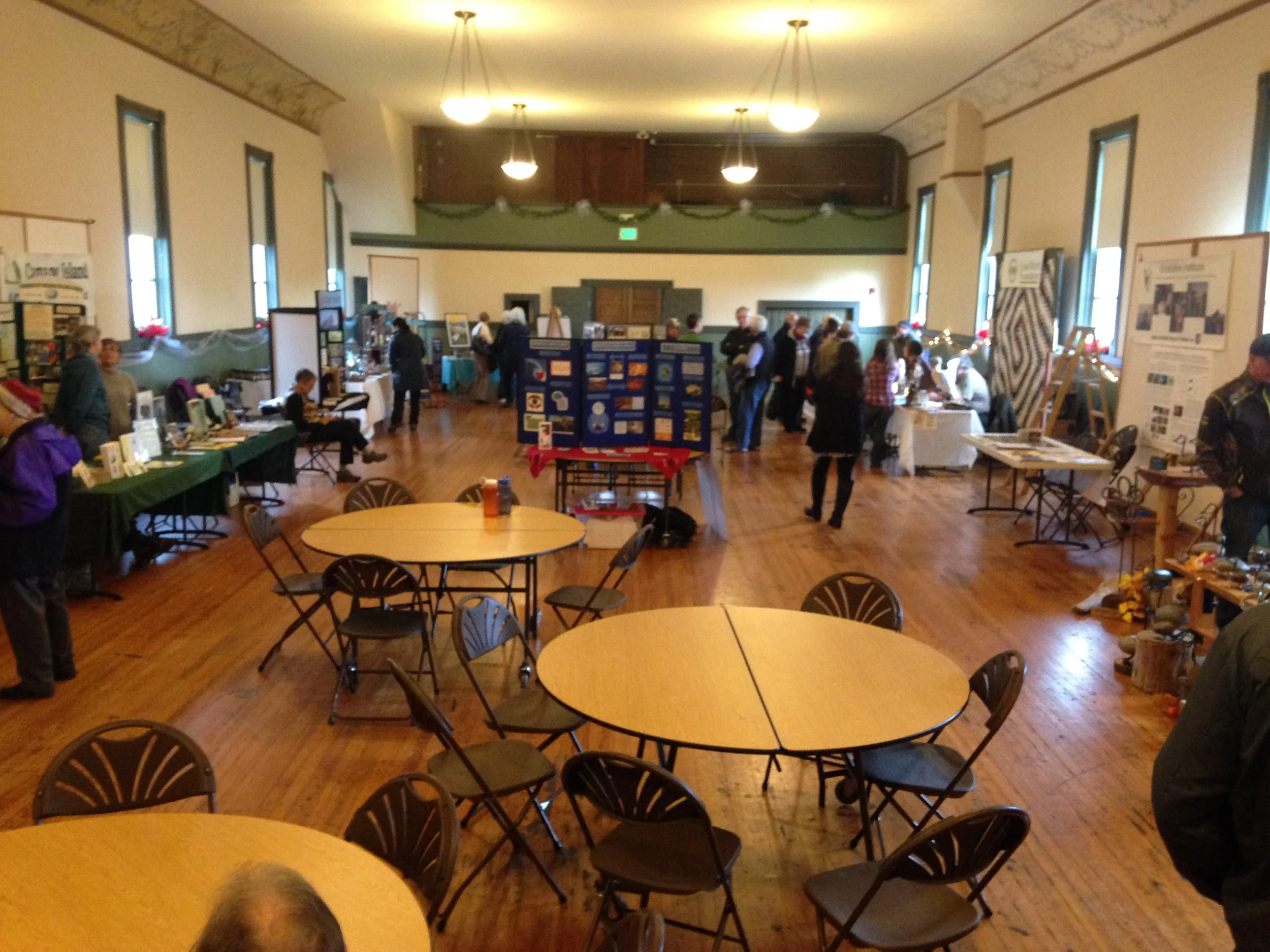 Port Susan Festival. Resource tables with information about climate warming: effects and solutions, birding, etc.