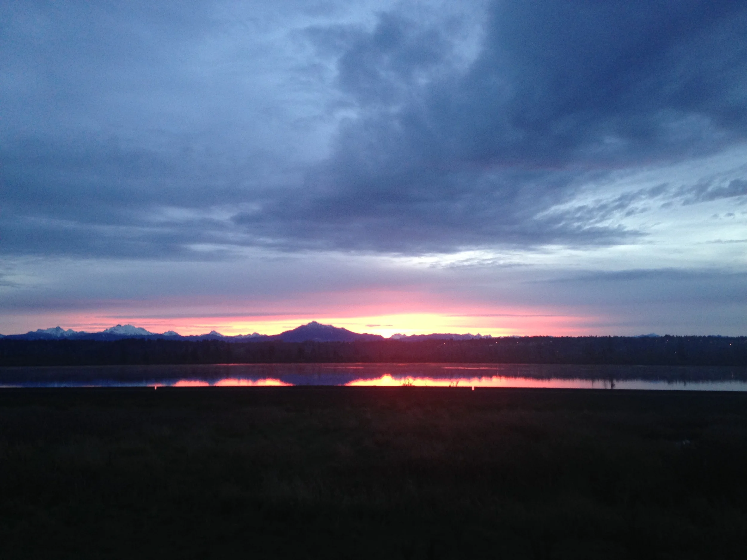 Driving north, I was greeted with this stunning sunrise over the Cascade Mountains. I pulled off the road to capture this photo.