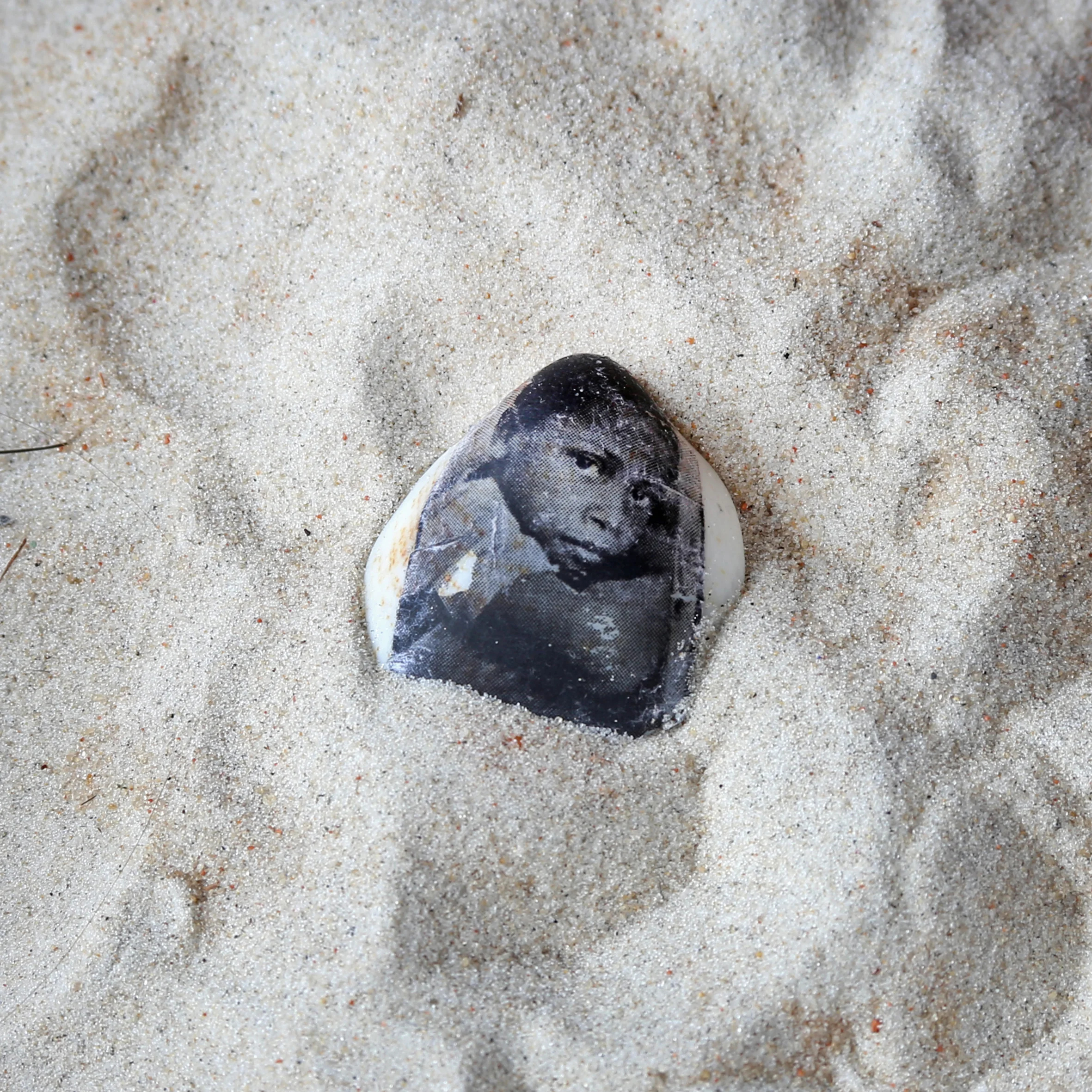 Printing on seashells found in the village of this little boy