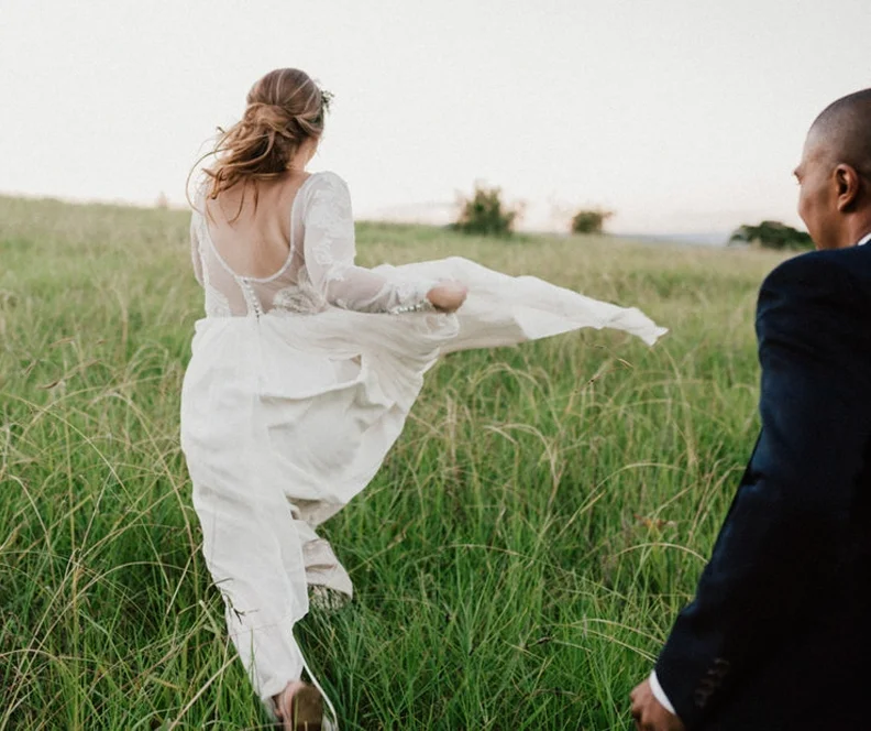 Hannah running free in her bespoke wedding gown