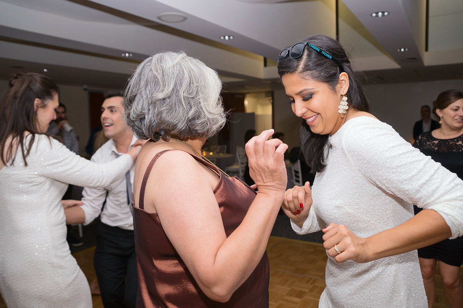 Bride and her mother dancing at the reception at GWU City View Room