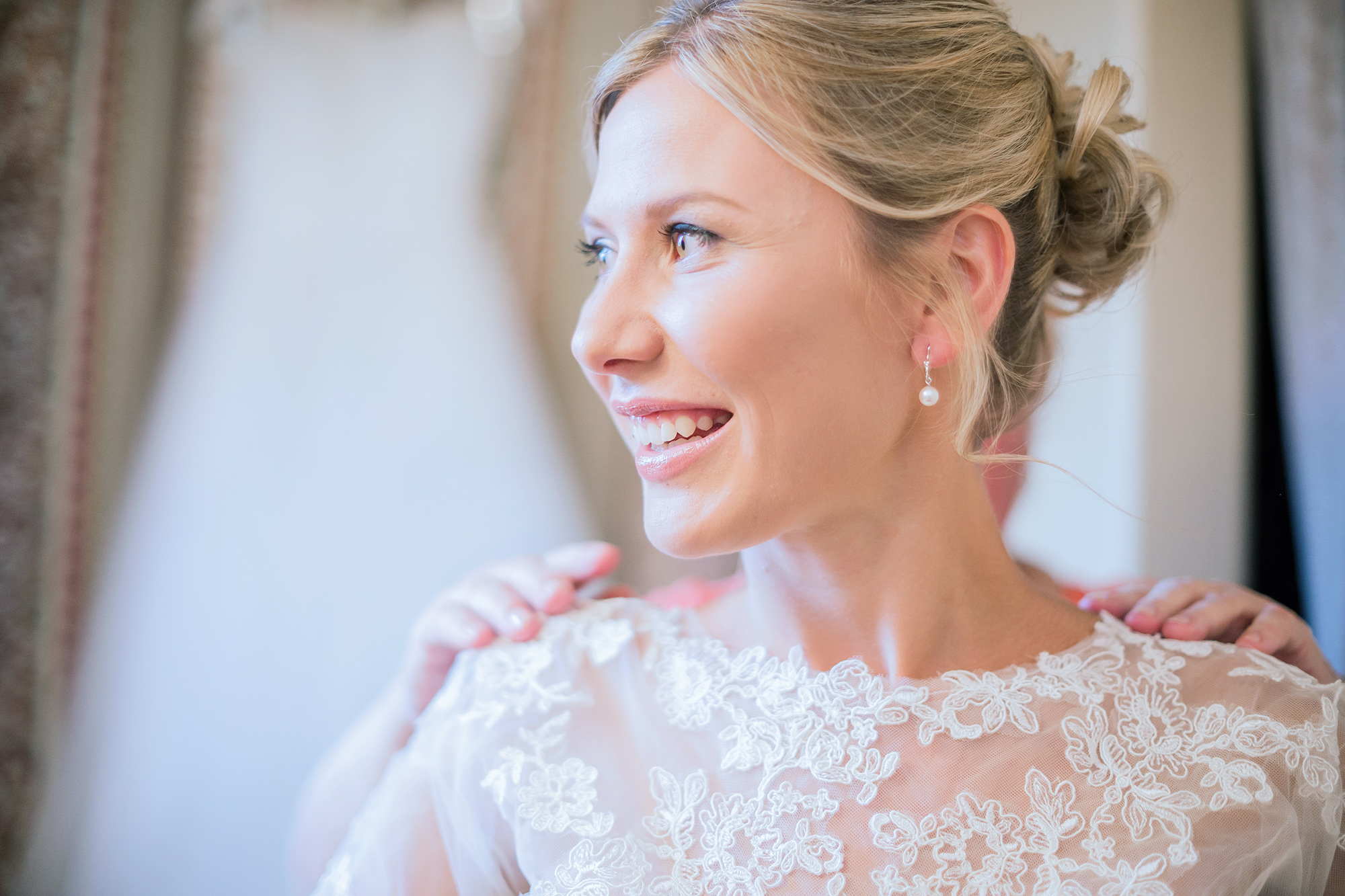 Bride getting ready at backyard DIY wedding at Athol Idaho