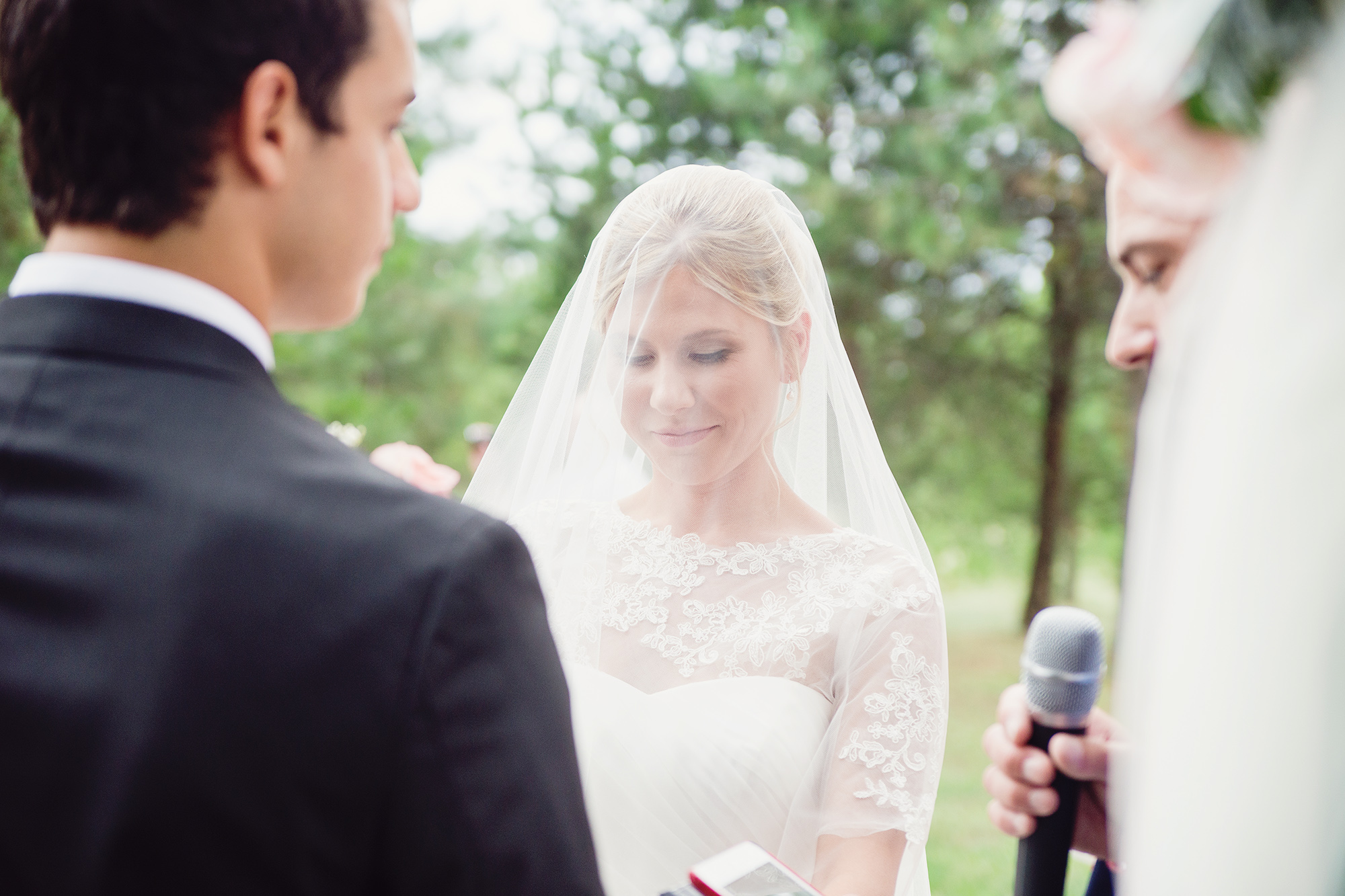 Bride under her veil in DIY backyard wedding