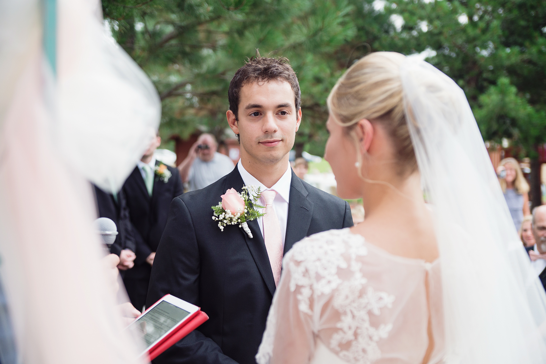 Groom looking at his bride during vows Idaho wedding ceremony