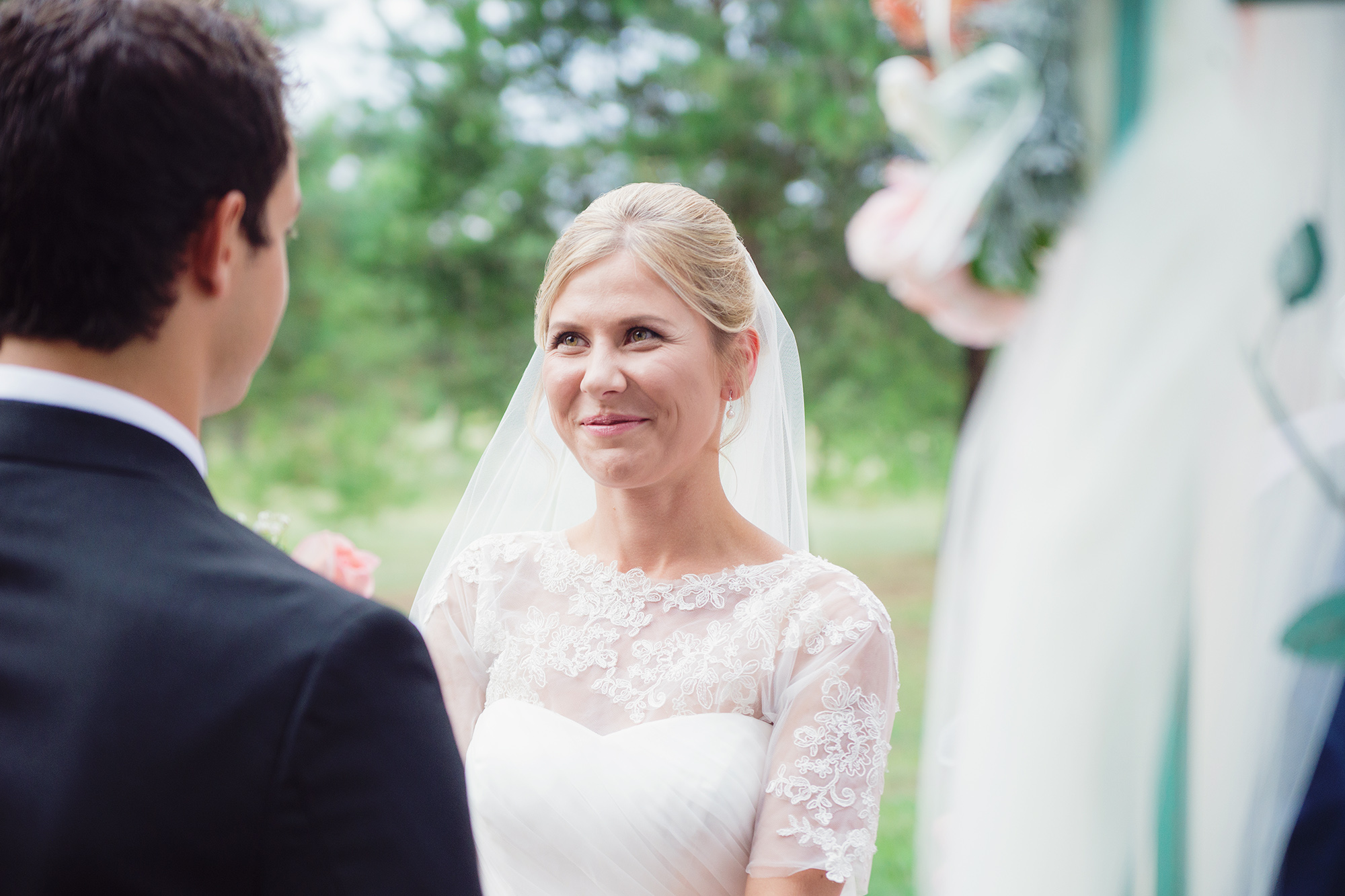 Bride during vows at backyard DIY Athol Idaho wedding