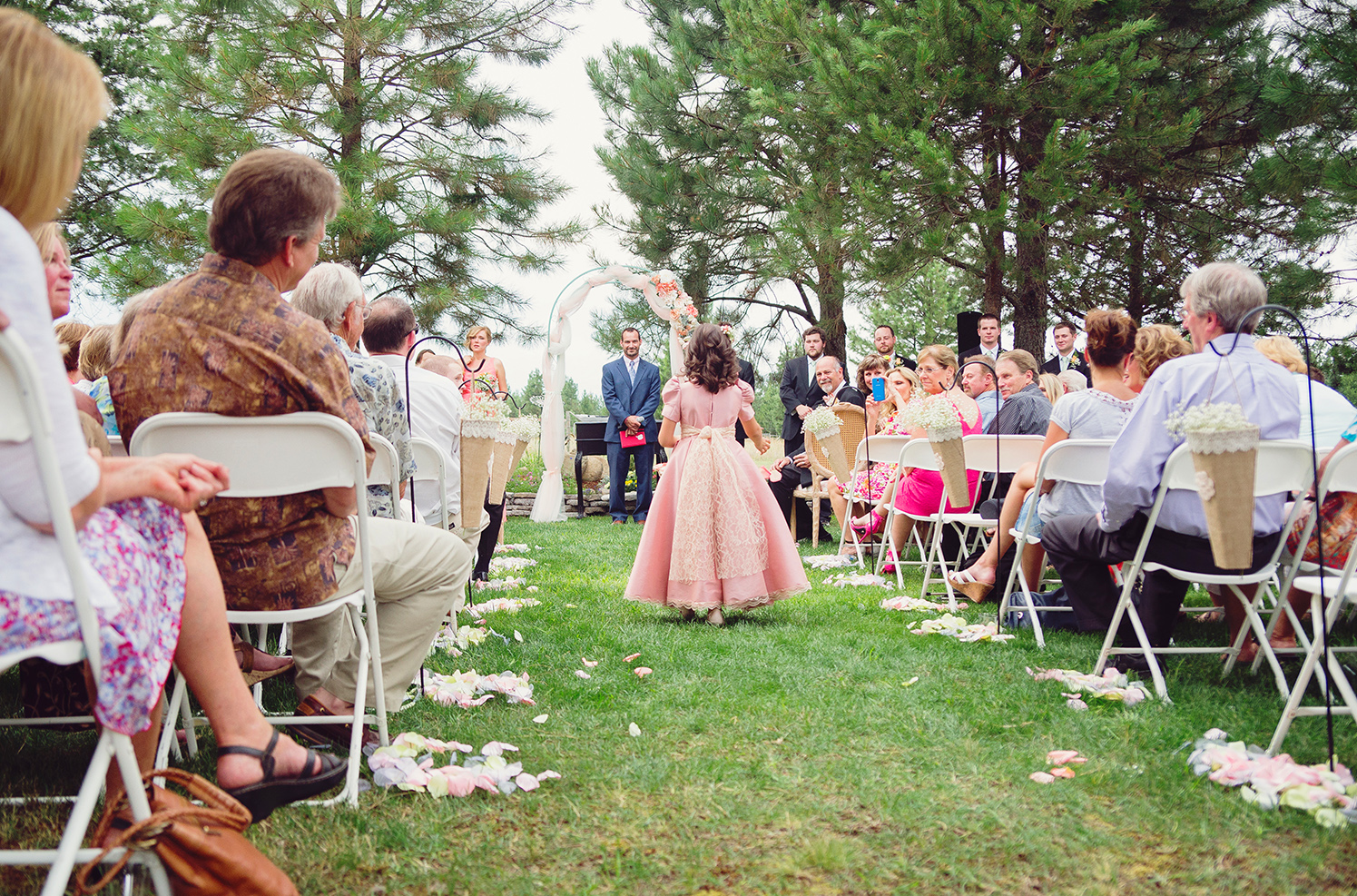 Flower girl at backyard DIY barn wedding in Athol Idaho