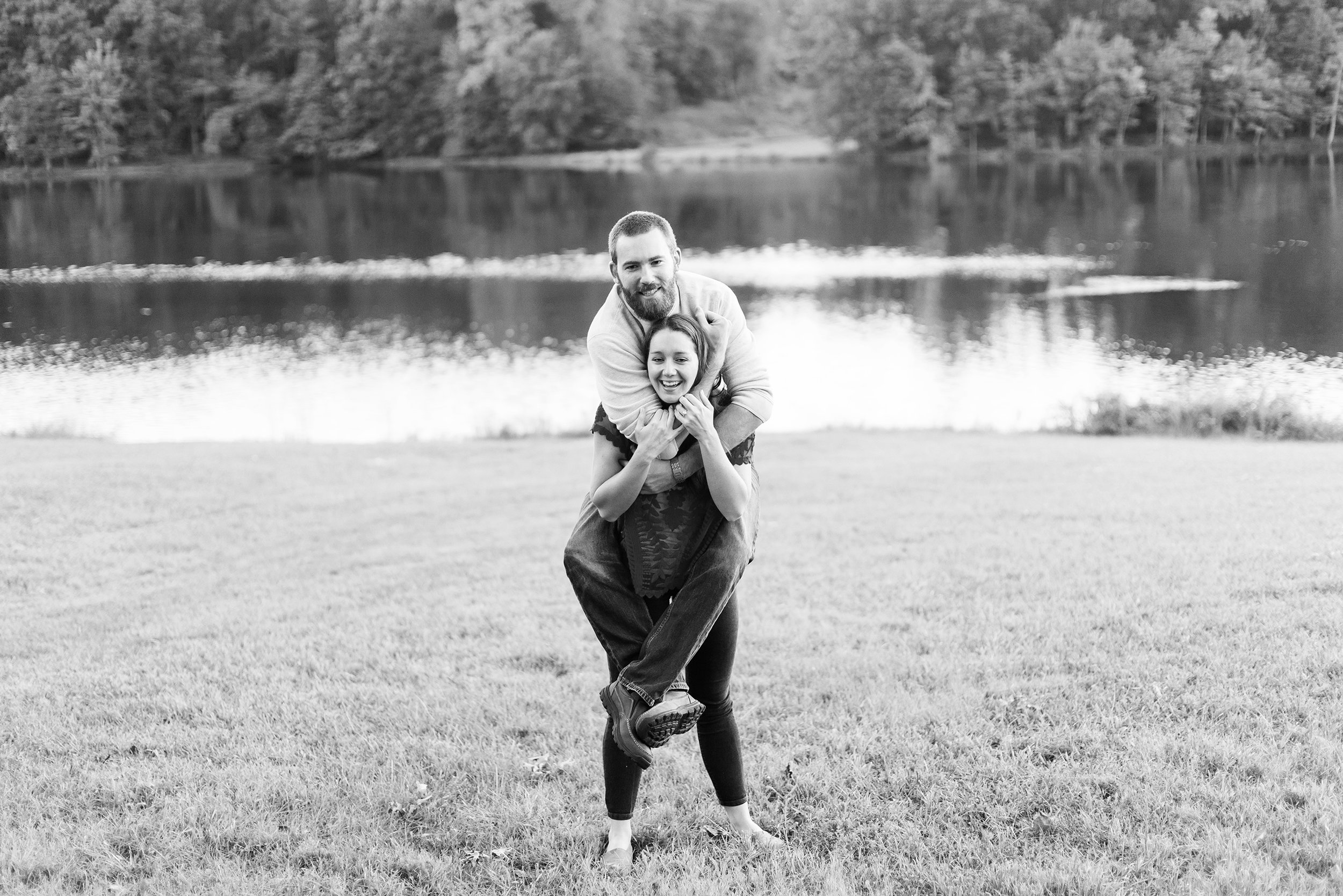 Piggy back engagement photos at Seneca Creek State Park by jessica nazarova