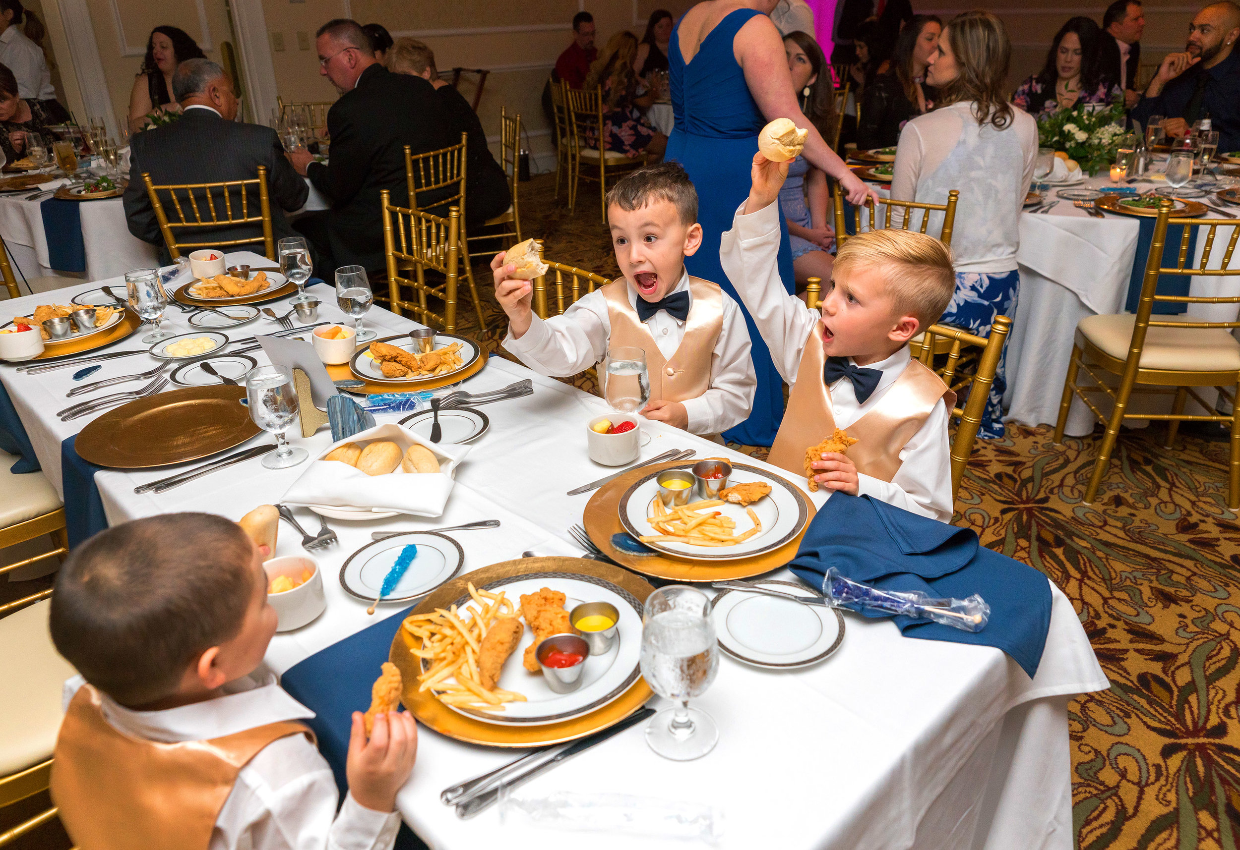 Hilarious kids eating chicken at Manor Country Club in Rockville wedding