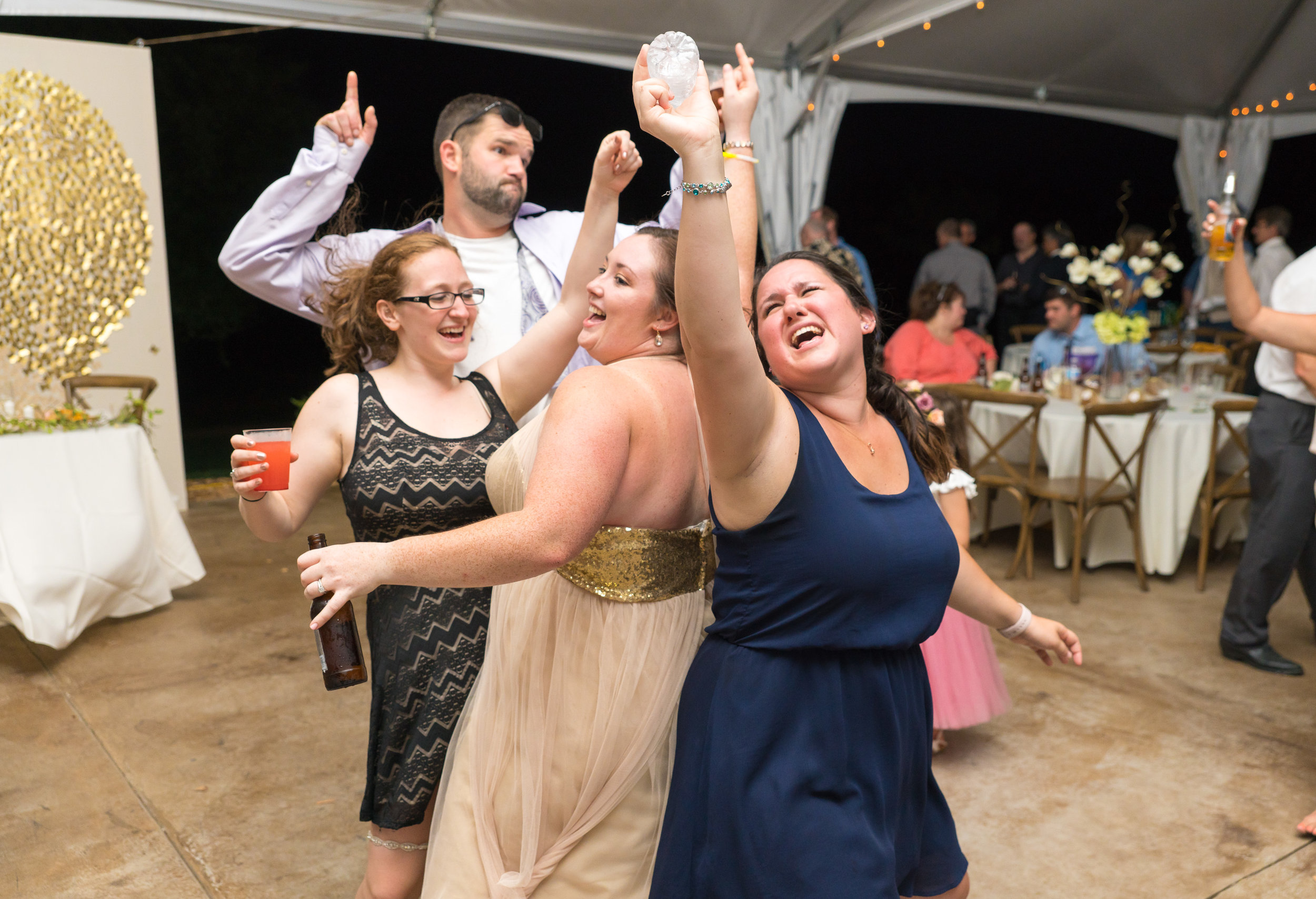 Bridesmaids and best friends dancing during the reception at Glen Ellen Farm