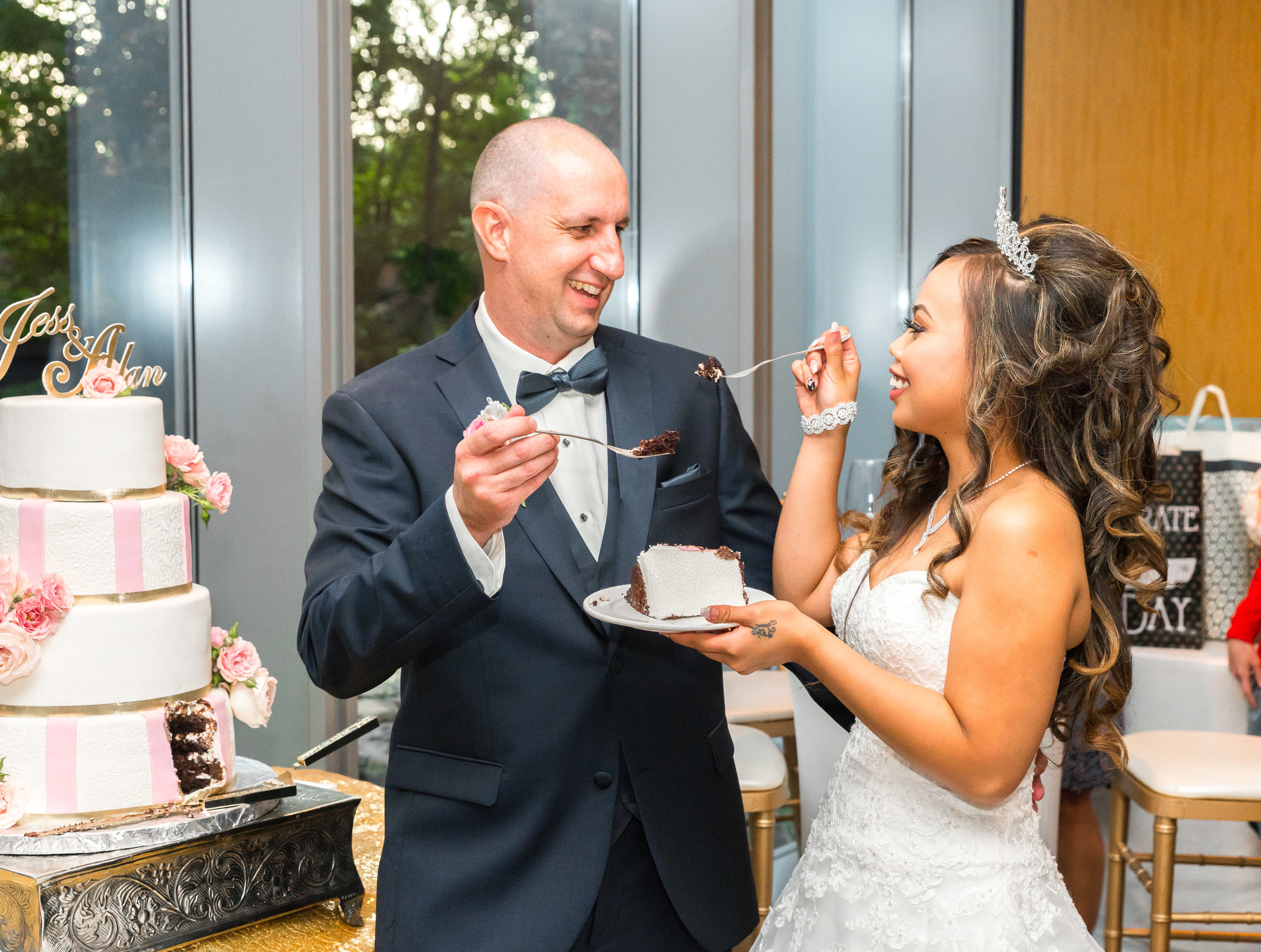 Bride and groom at 2941 feeding each other cake