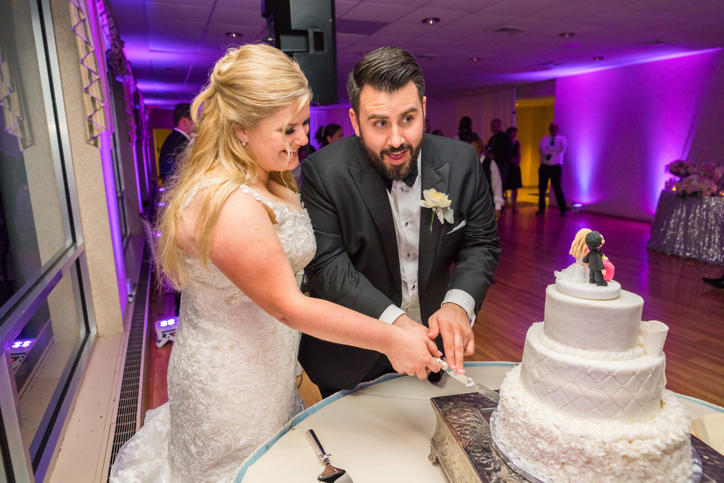 Cake cutting photos at Ft Belvoir wedding in virginia