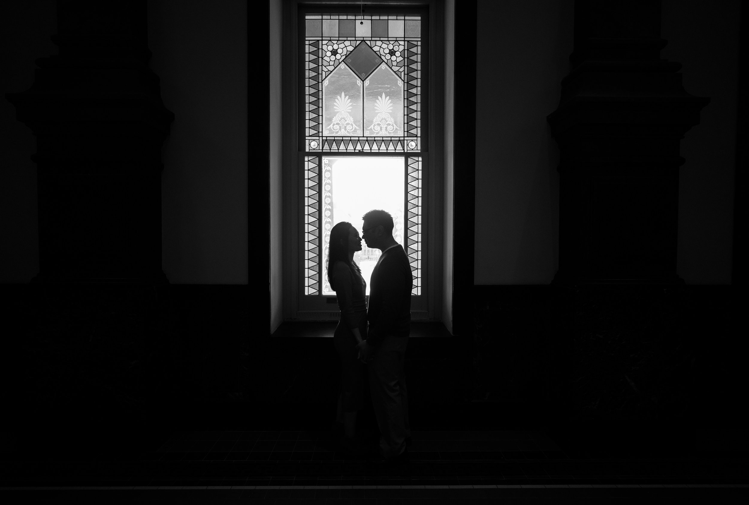 Black and white silhouette engagement photos at the Smithsonian museum