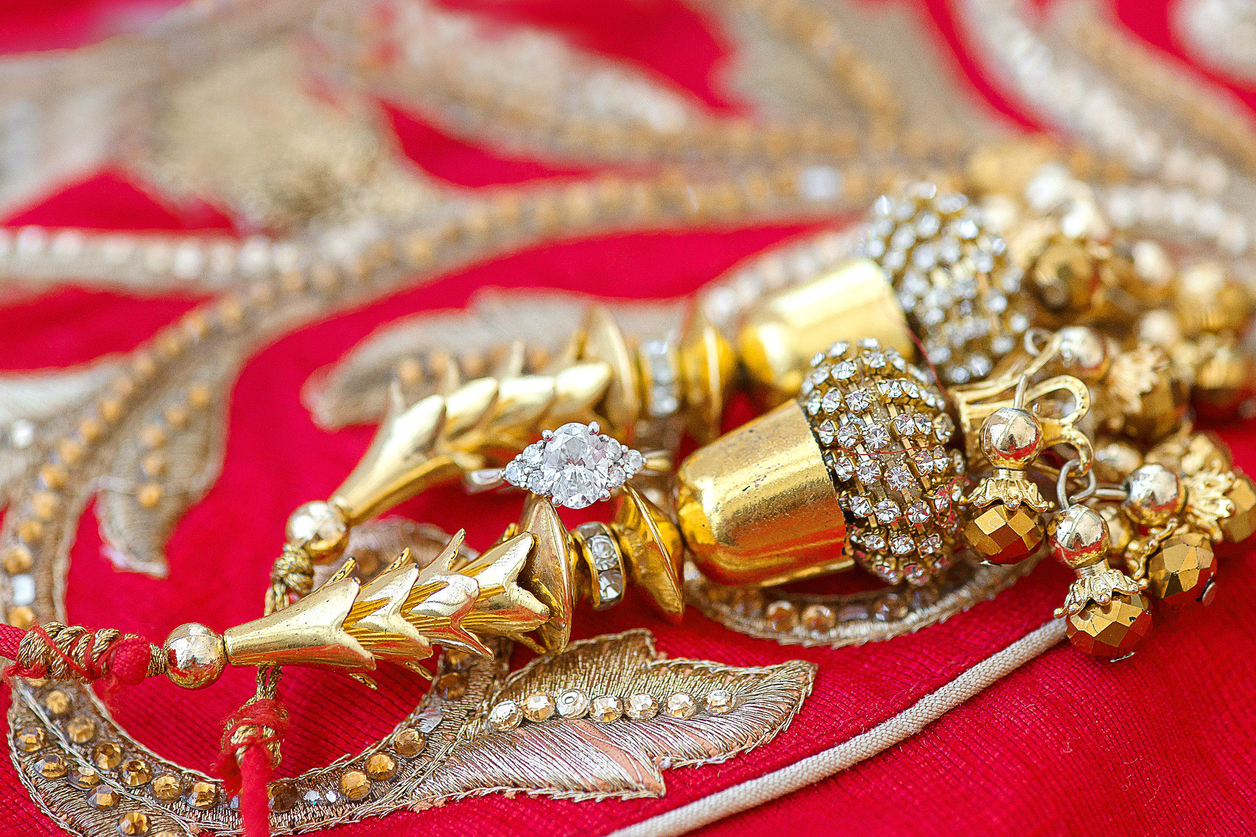 Amazing ring photo on red and gold lehenga Celebrations at the bay 