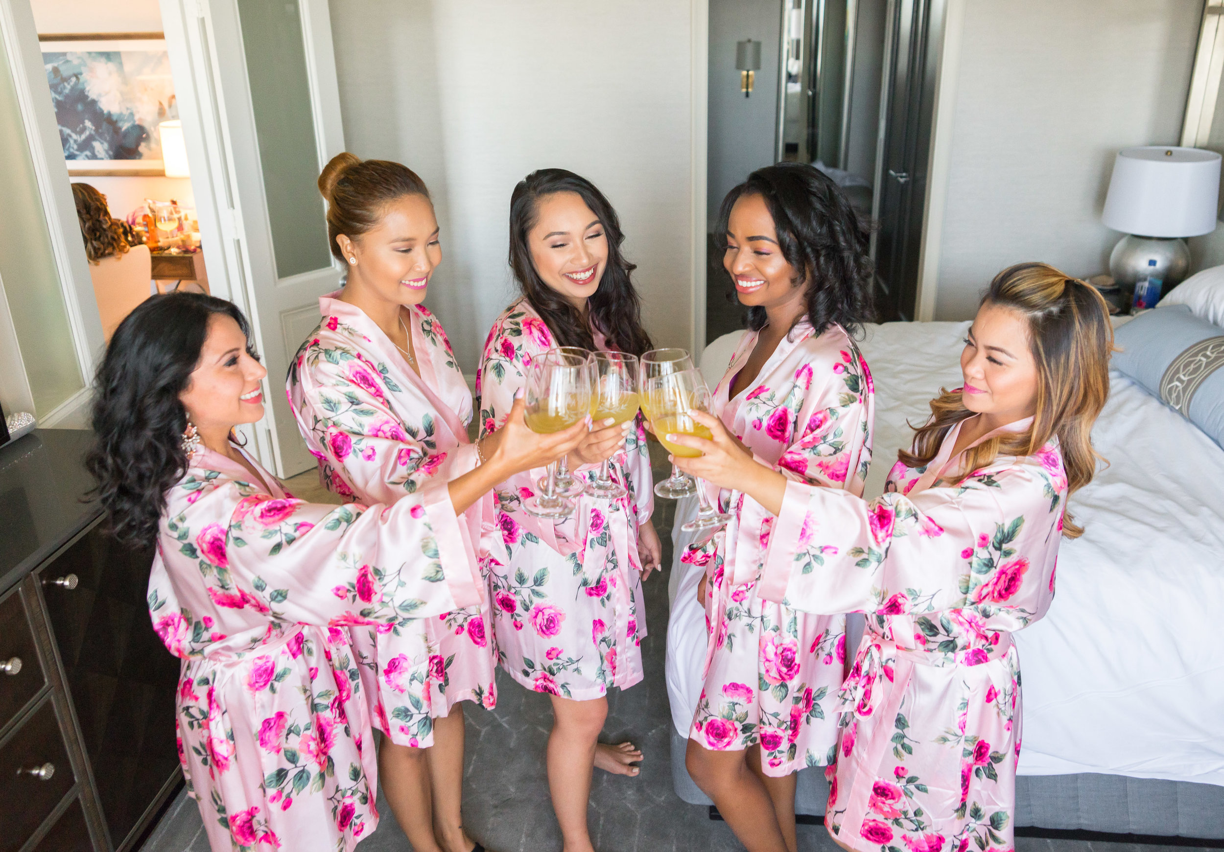 Bridesmaids in matching floral robes 
