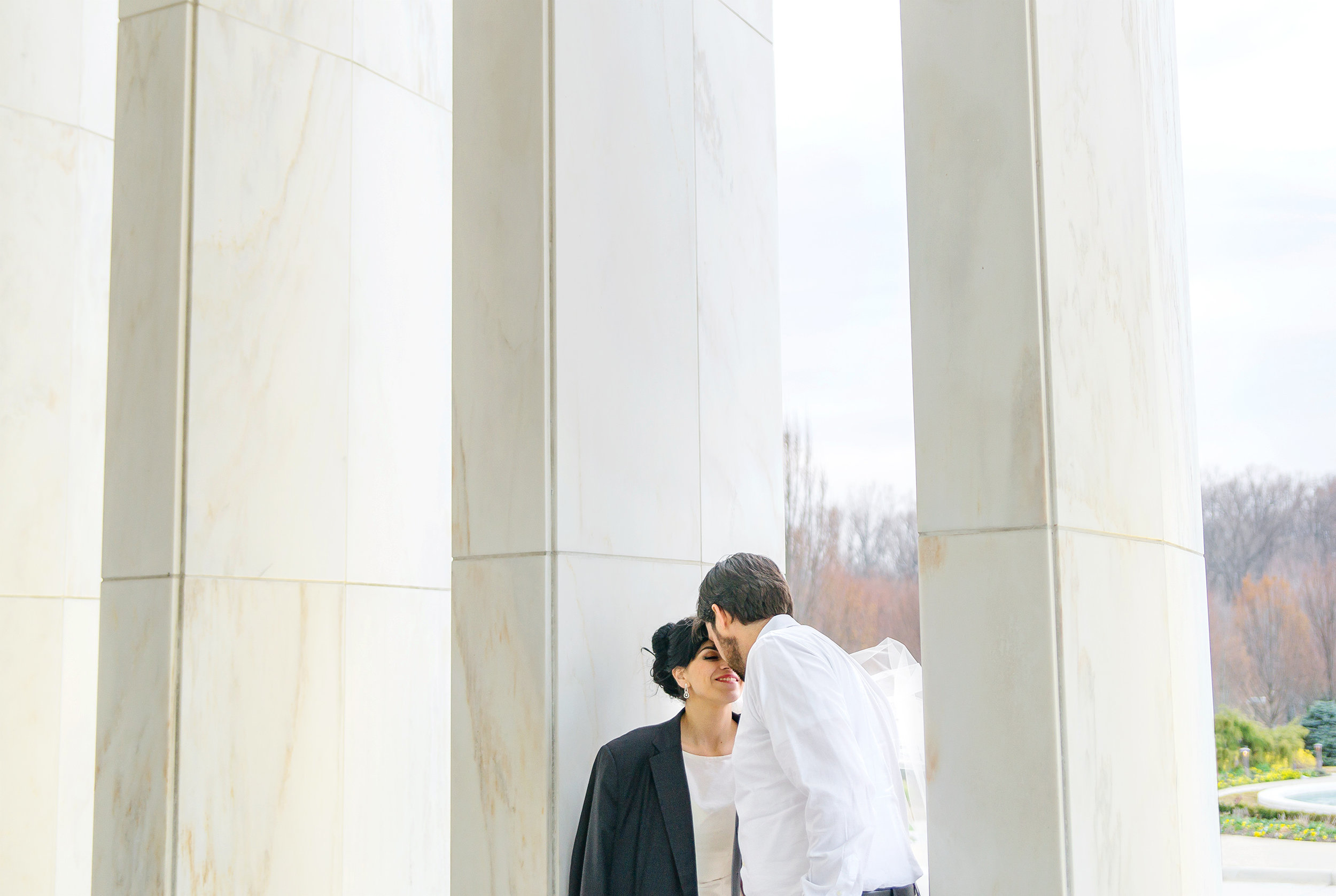 LDS temple and columns with bride and groom portraits 