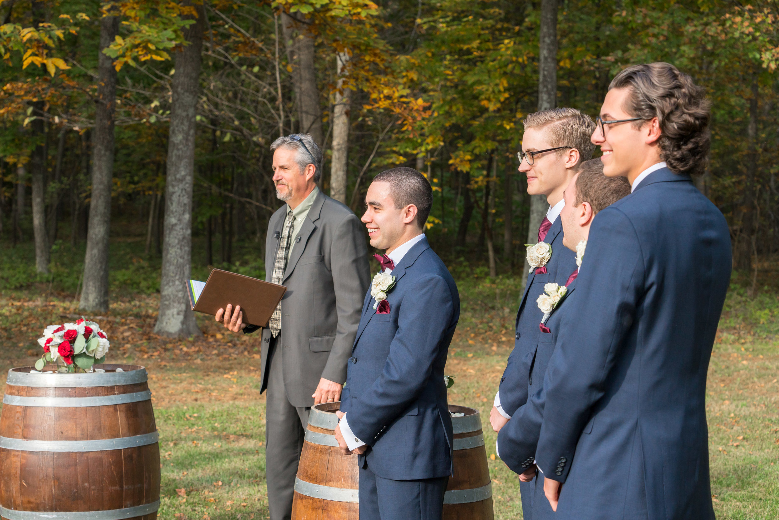 Groom at outdoor wedding ceremony at Lost Creek Winery