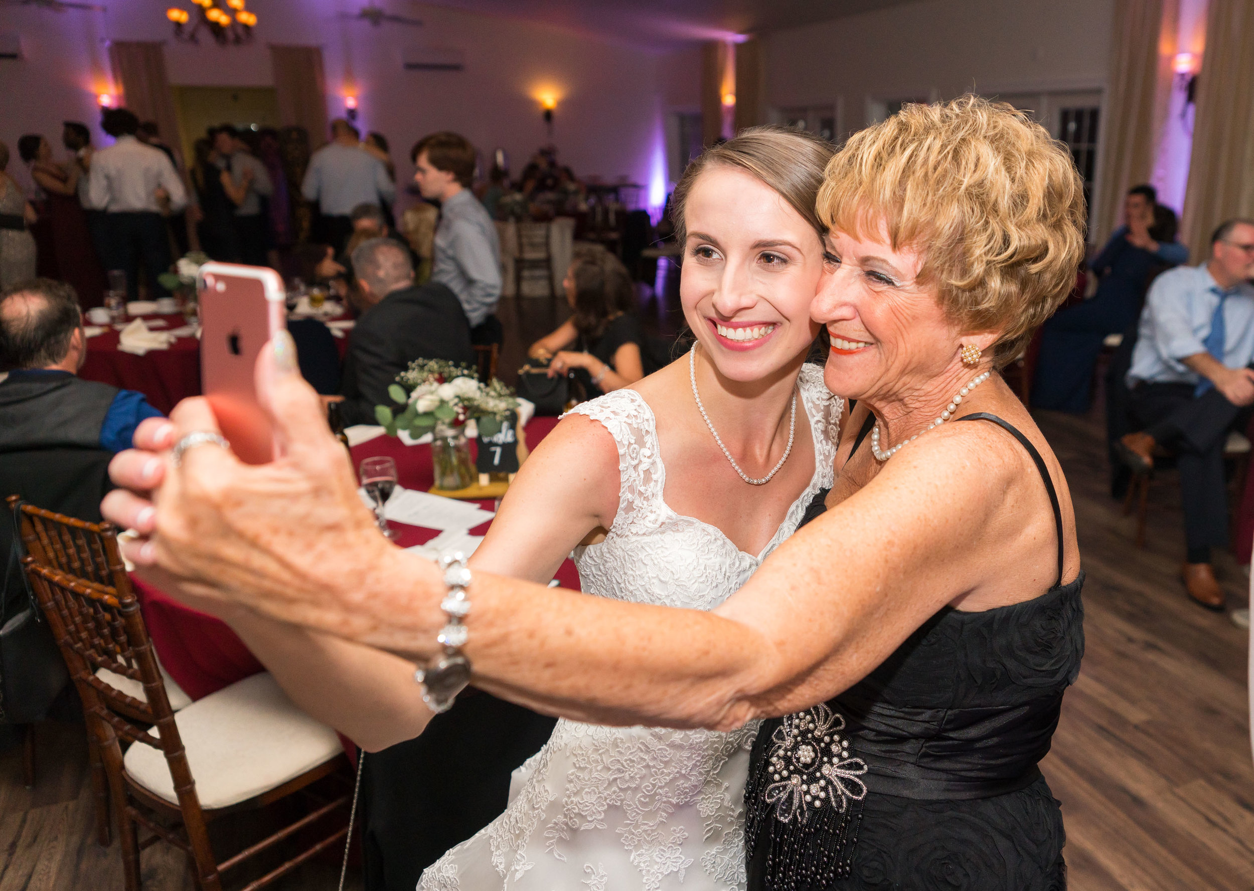 Bride and grandma taking a selfie at Harvest House
