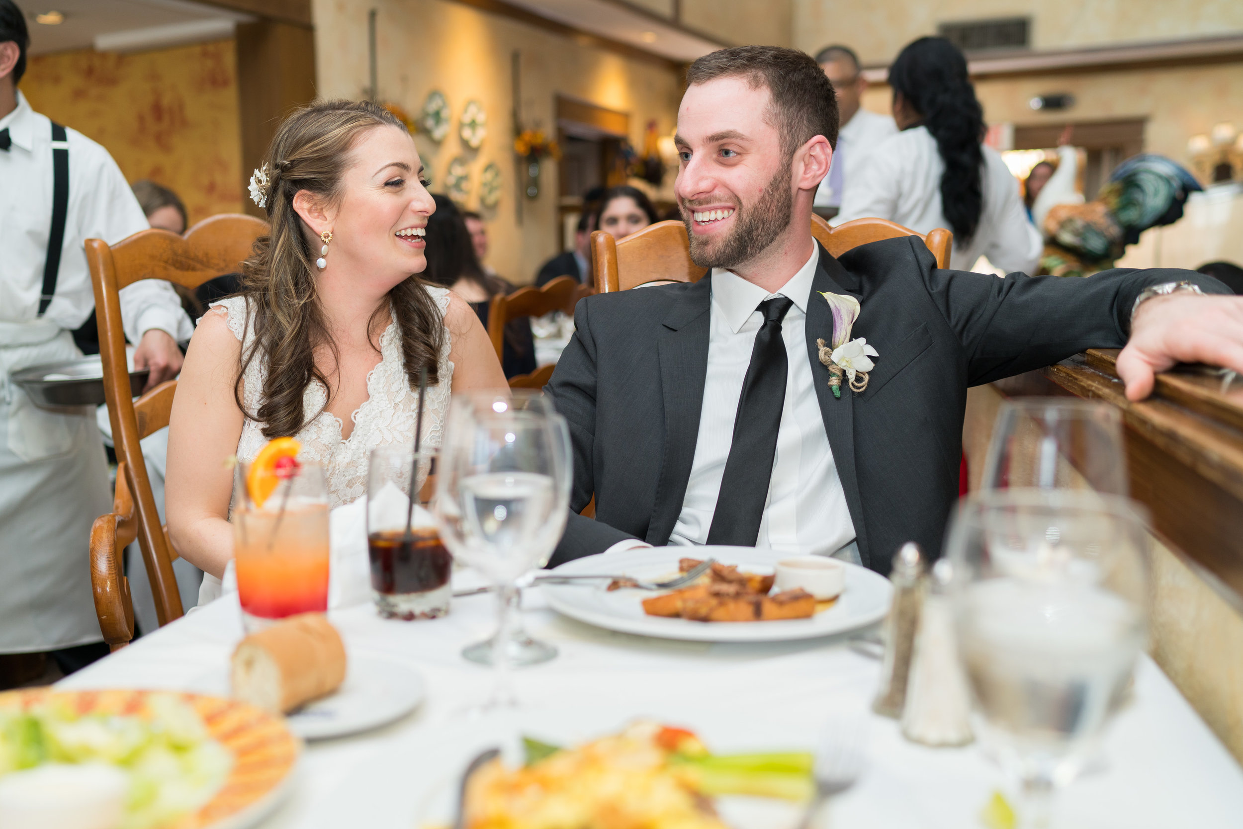 Laughing at the toasts at La Ferme wedding reception