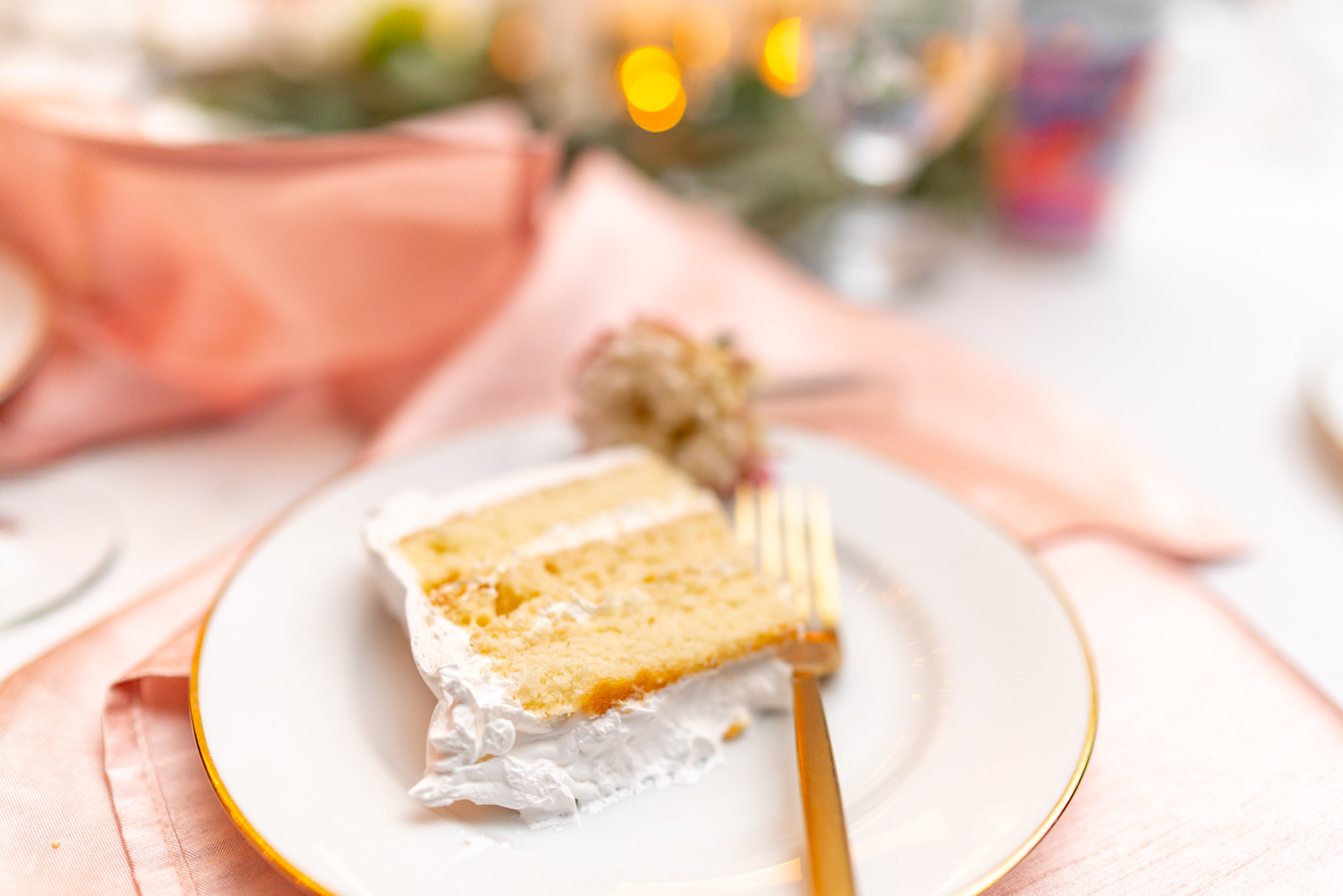 Yellow cake and white frosting and rose gold details at Hendry House wedding