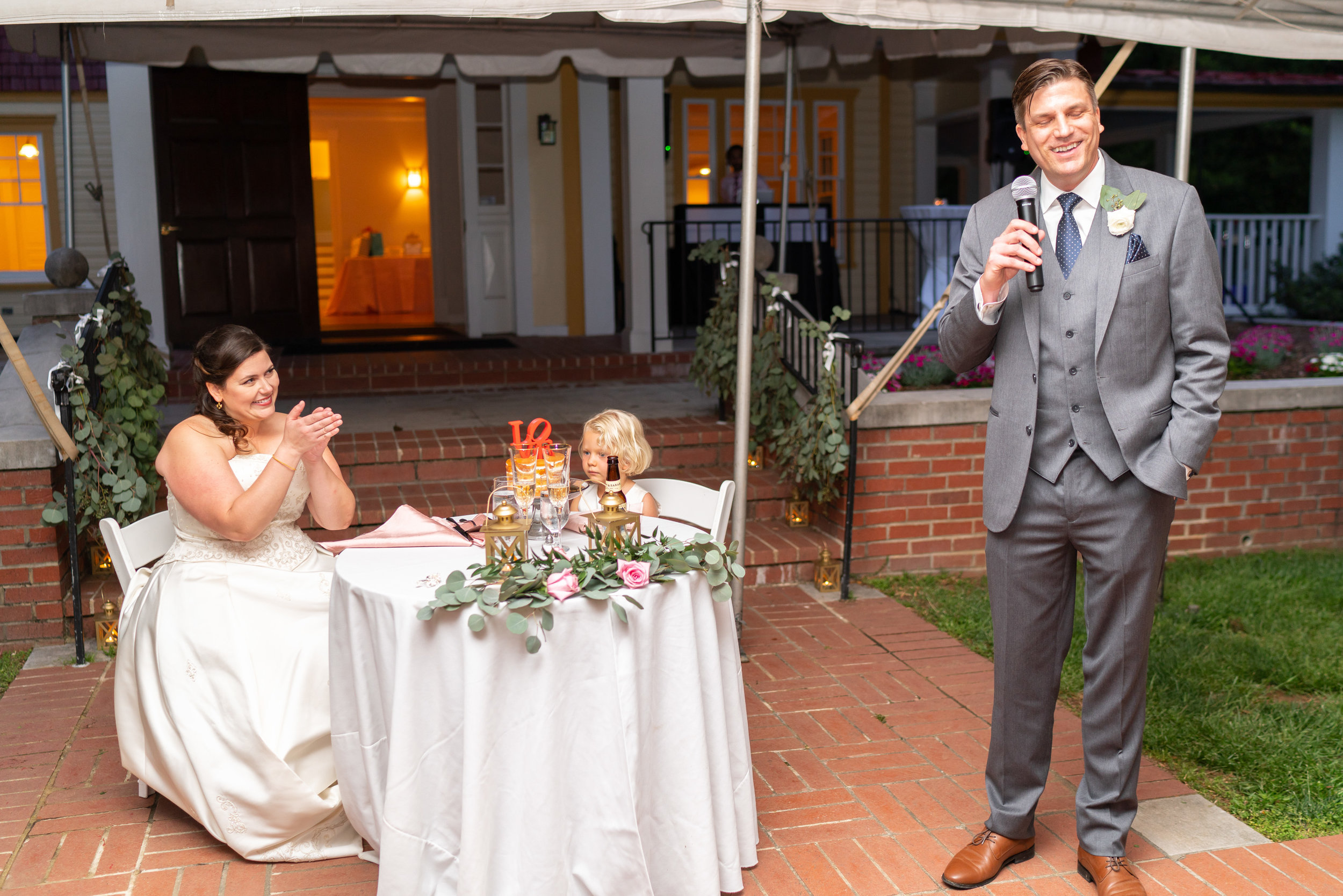 Groom giving a toast at Hendry House tented wedding reception