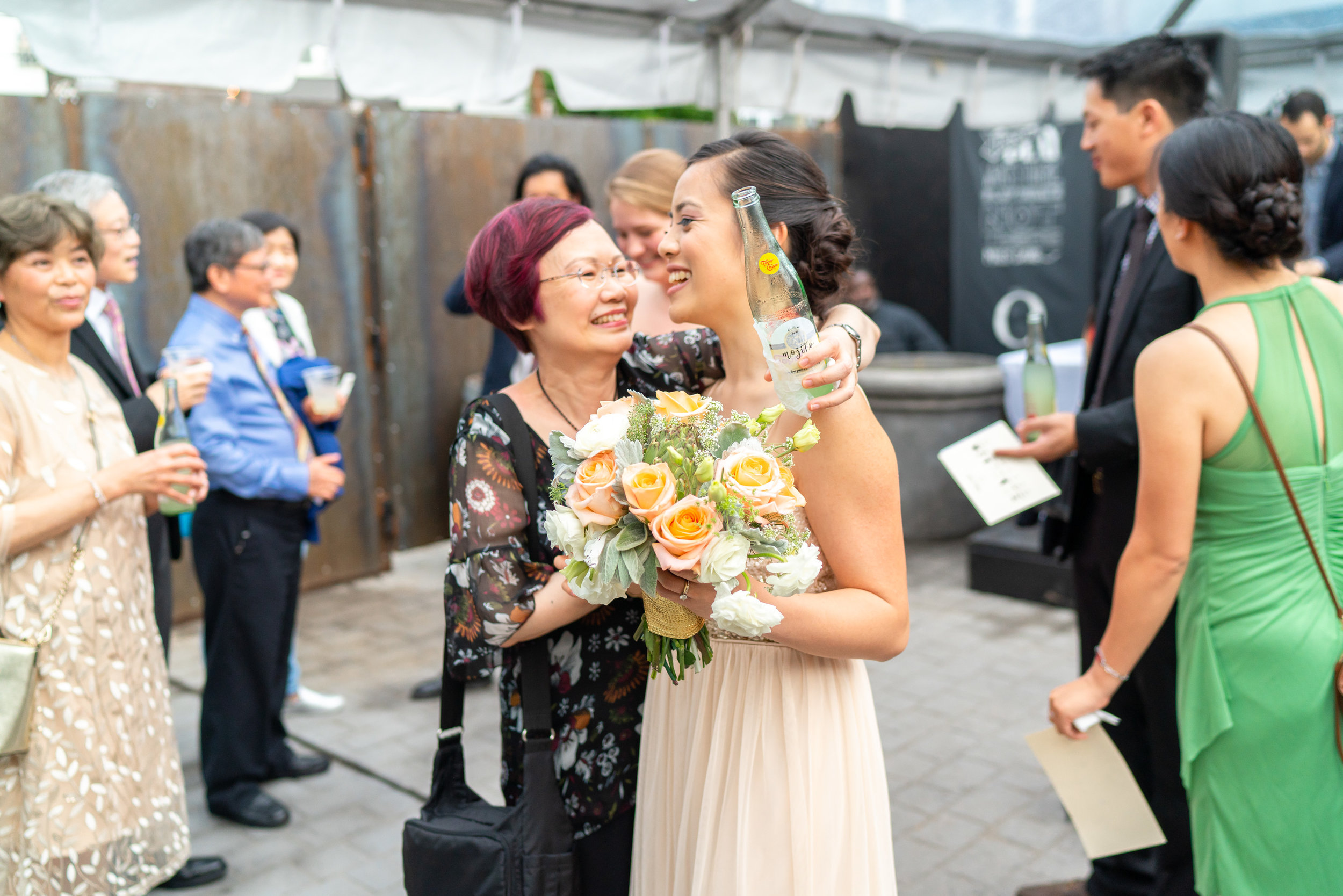 Wedding guests during cocktail hour at Gallery OonH urban venue in DC