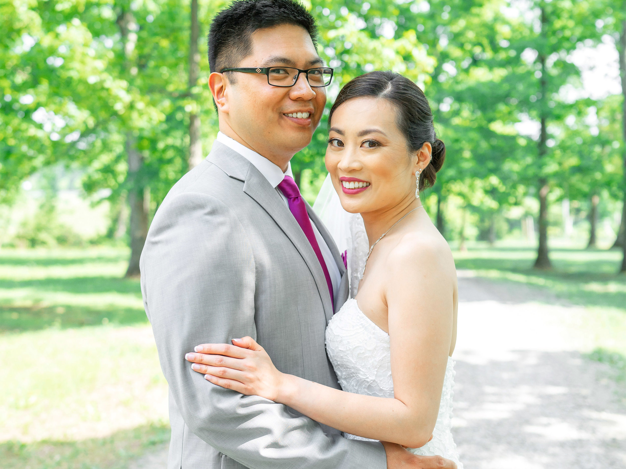 Bride and groom at Harvest House at Lost Creek gravel pathway in trees