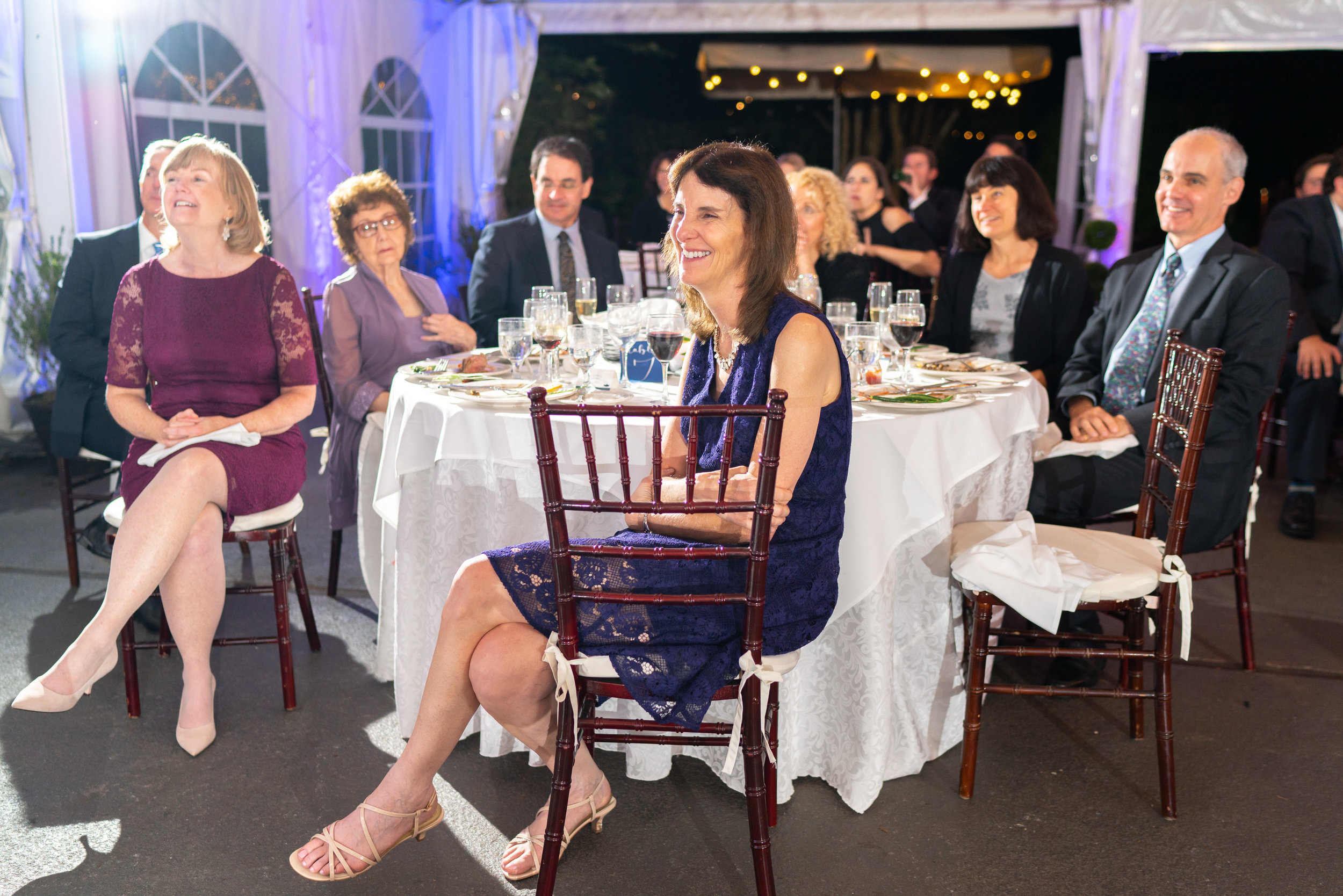 Parents listening to the toasts at wedding reception at Elkridge Furnace Inn