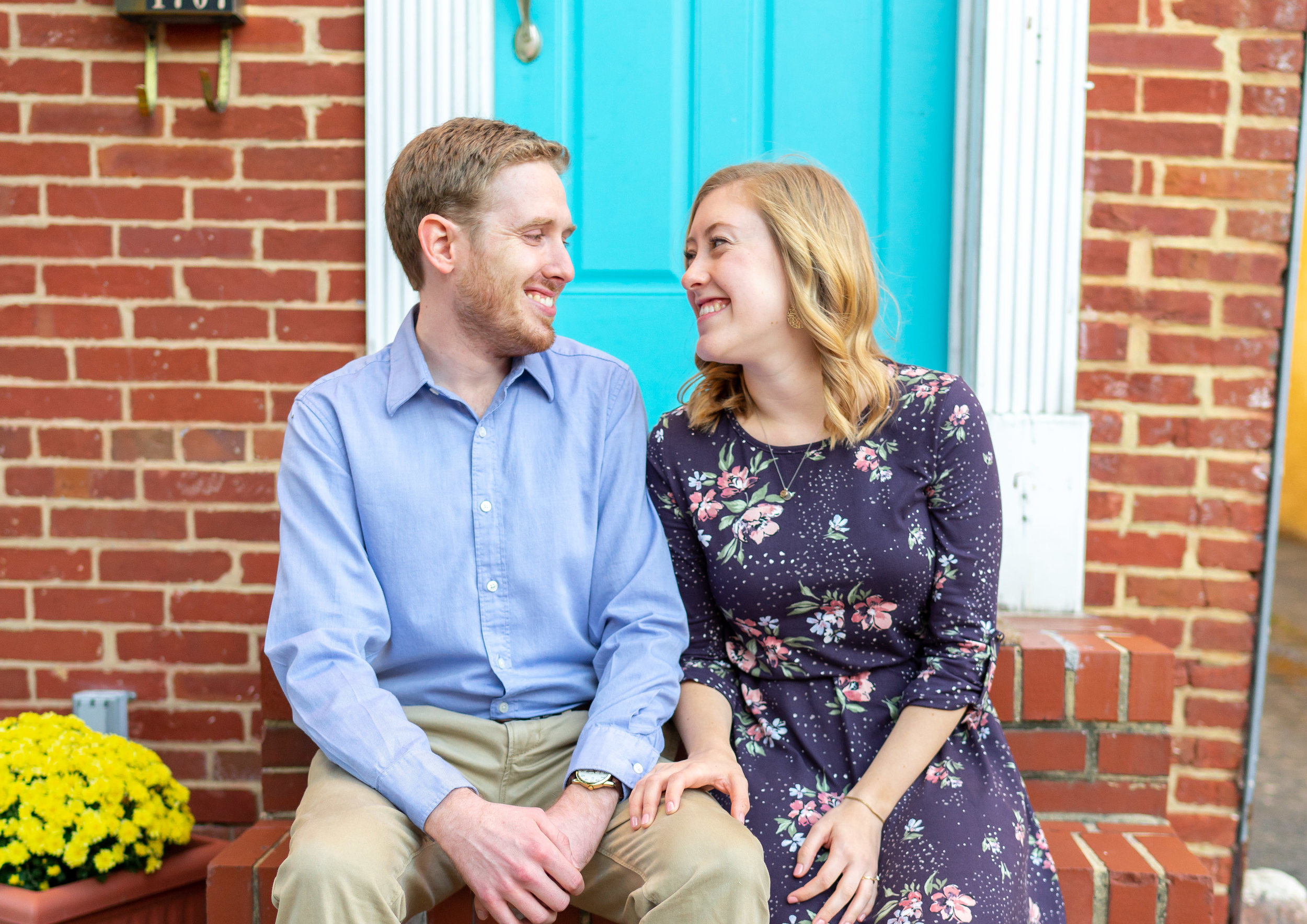 Baltimore Federal Hill engagement session in front of turquoise teal front door