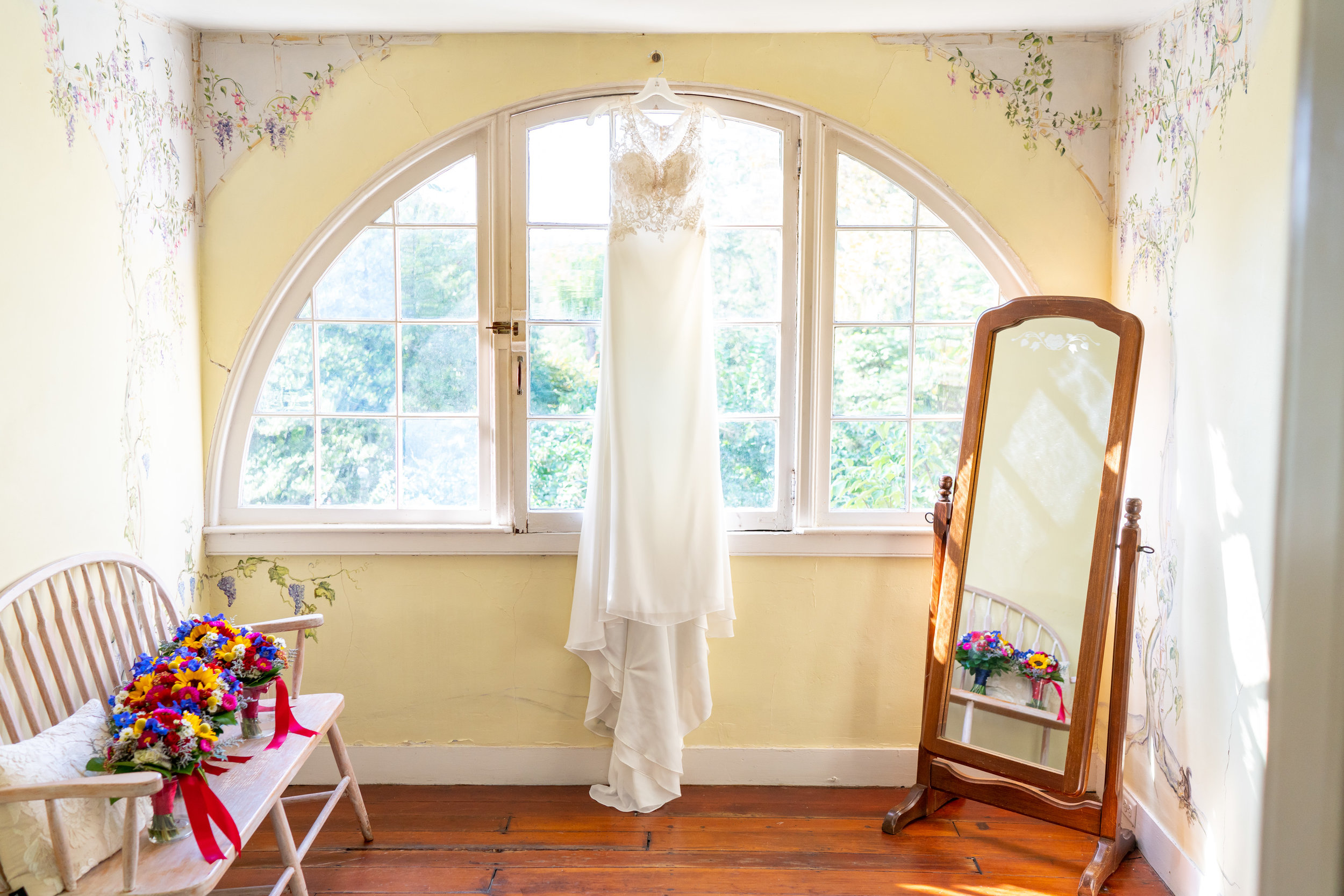 Bride's Morilee Myka gown hanging in window at Elkridge Furnace inn (similar to Keisha gown)