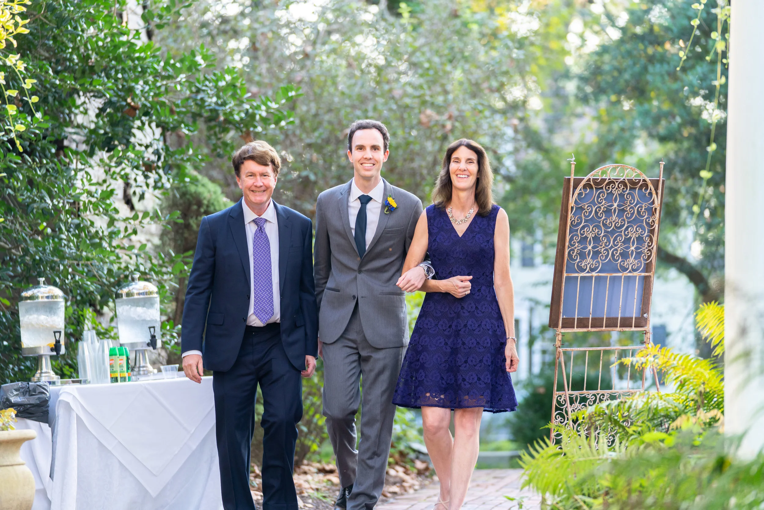 Parents walking the groom down the aisle at wedding at Elkridge Furnace Inn
