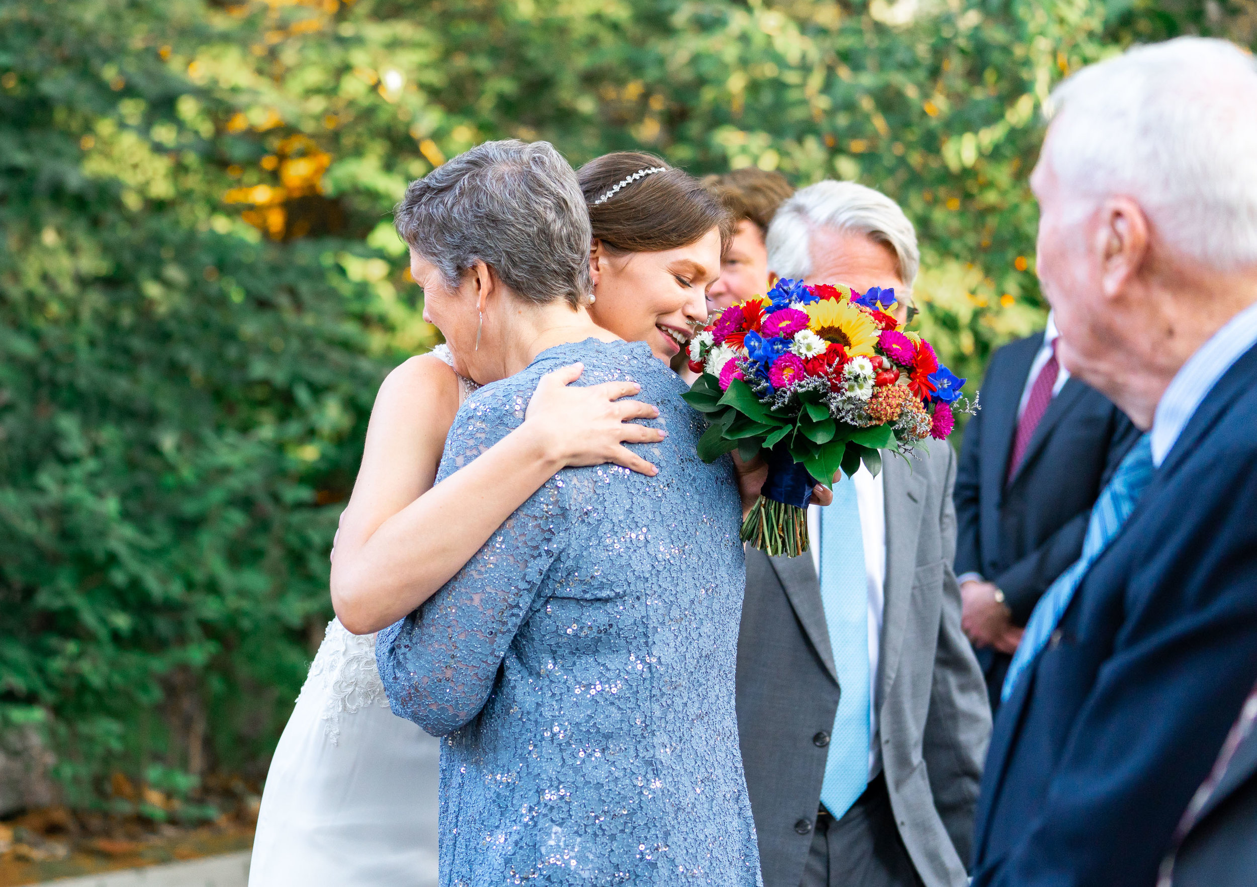 Bride and mom hugging before wedding ceremony at Elkridge Furnace Inn photos