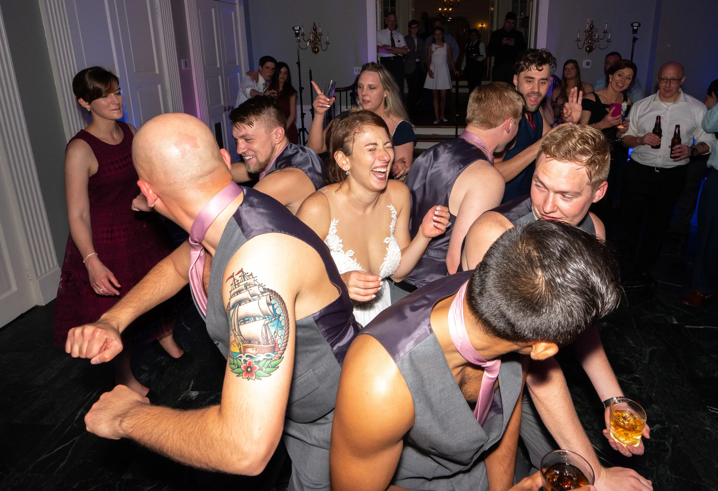 Groom and groomsmen chippendale at Glenview Mansion wedding reception fun wedding photography