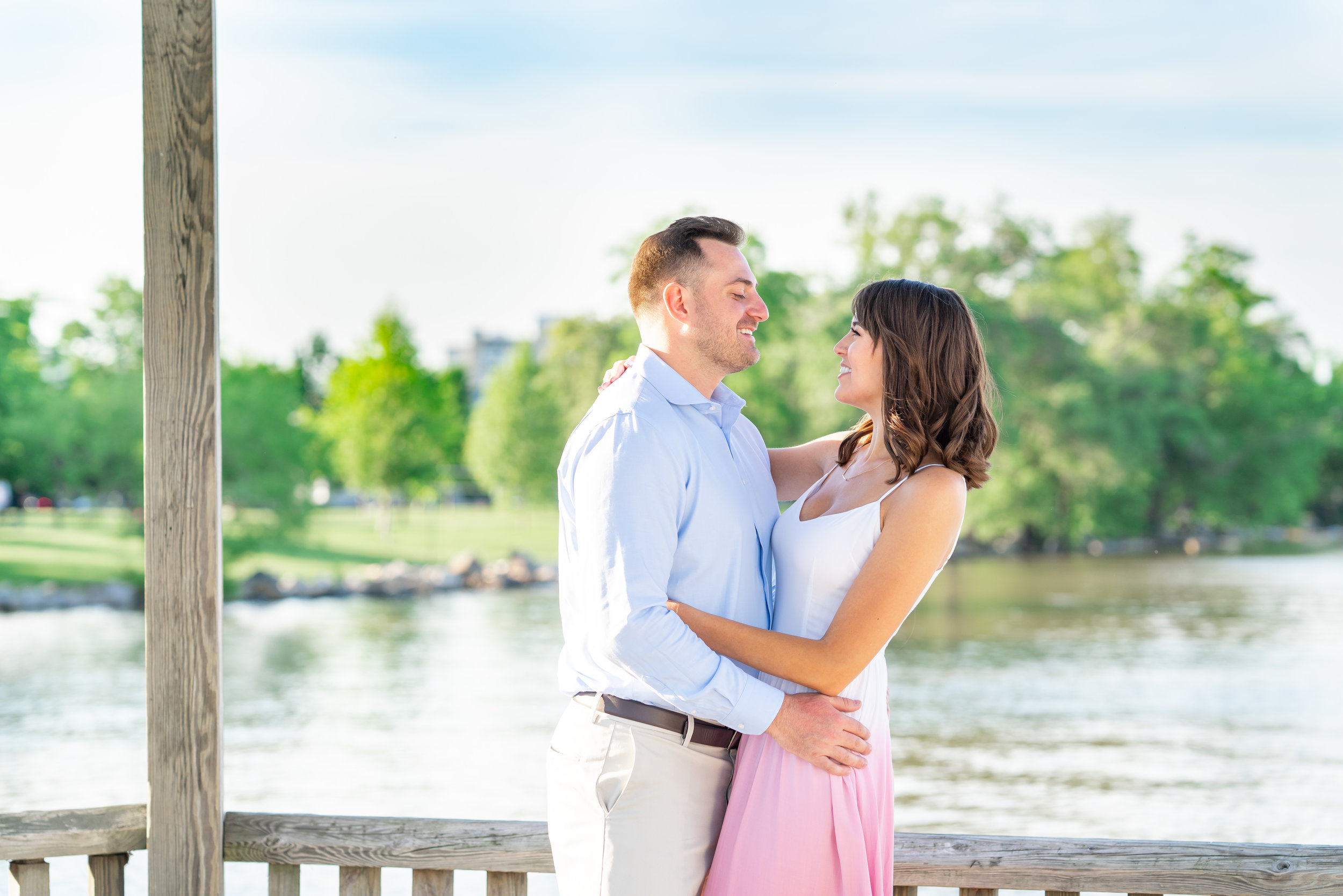 waterfront engagement photos on the dock with bride and groom