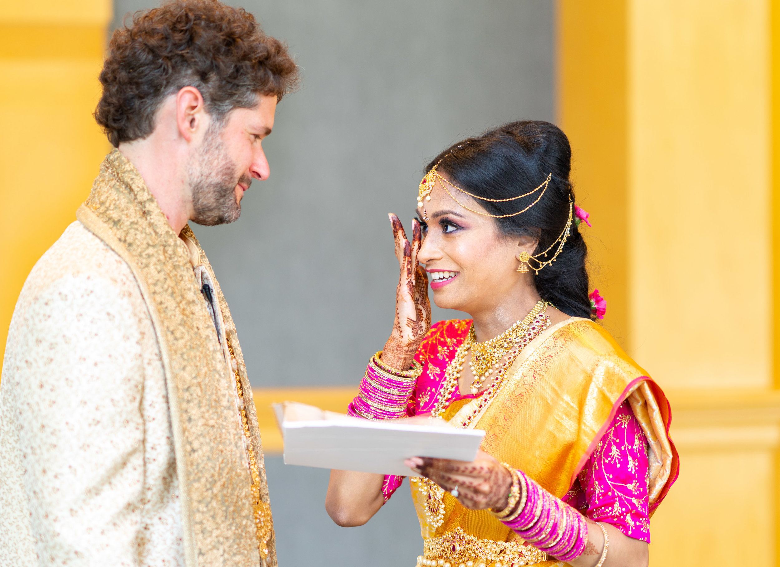 Indian bride crying while reading vows during first look