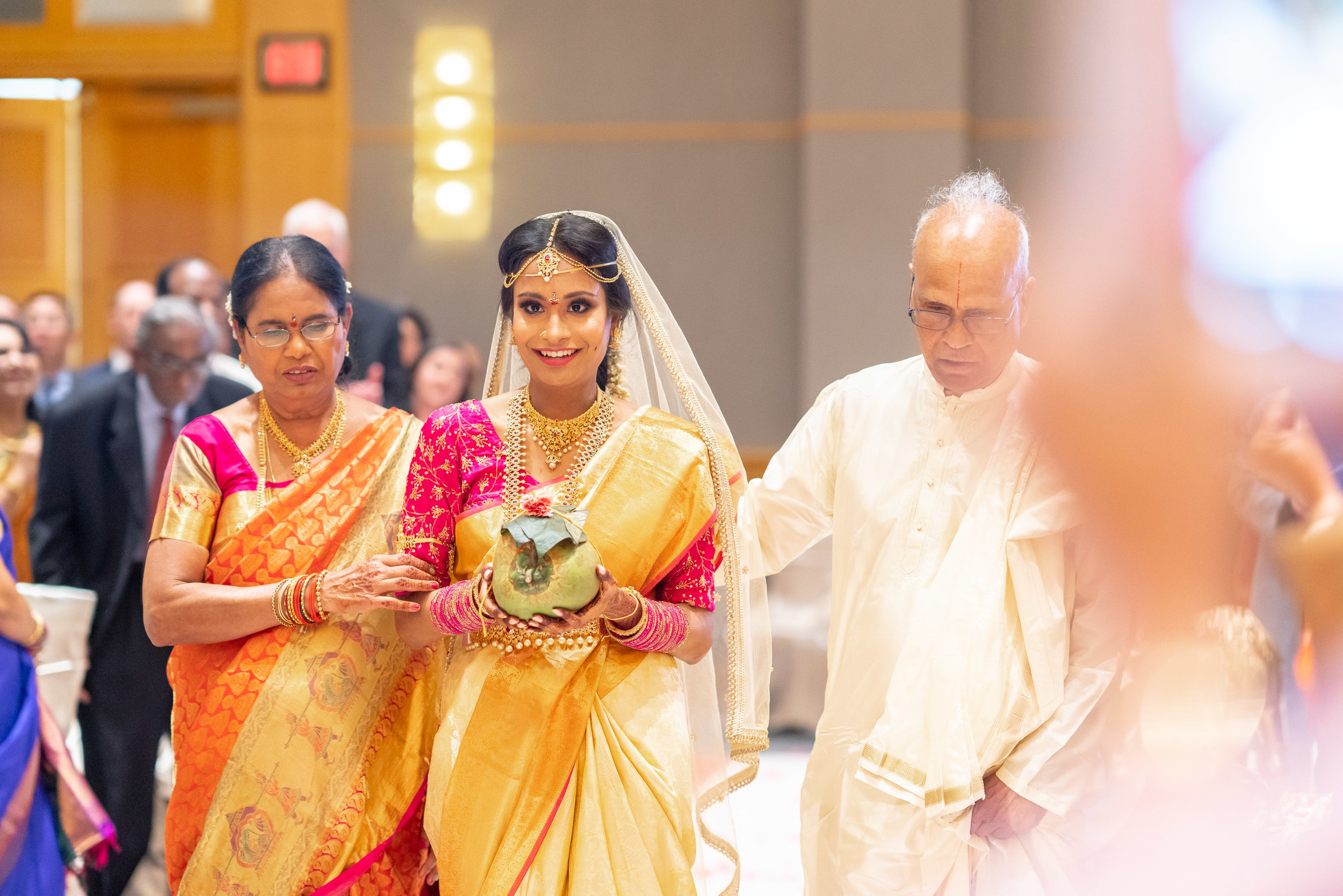Indian bride walking down the aisle at bethesda north marriott wedding