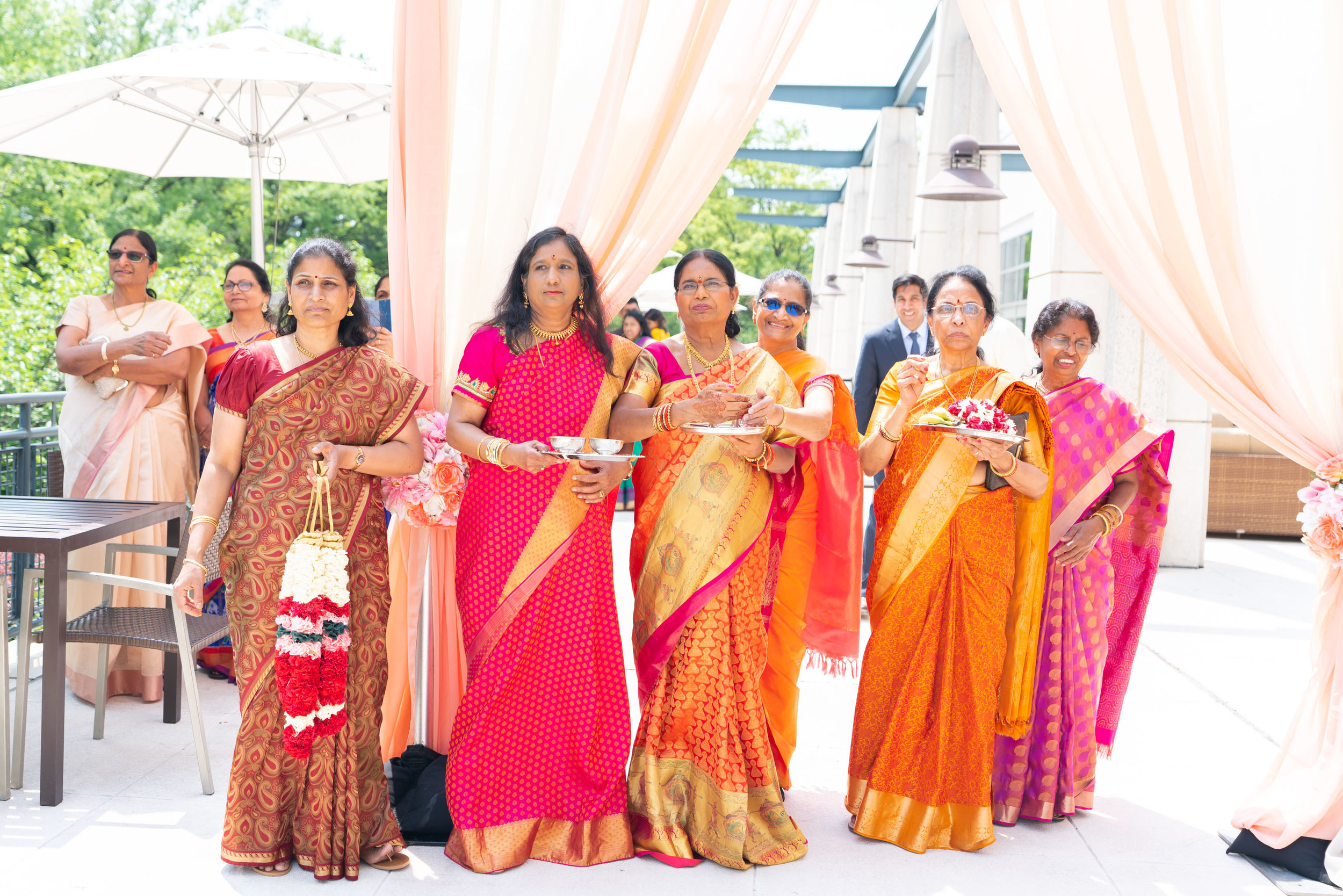 Indian mother and aunties waiting for the groom at the baraat