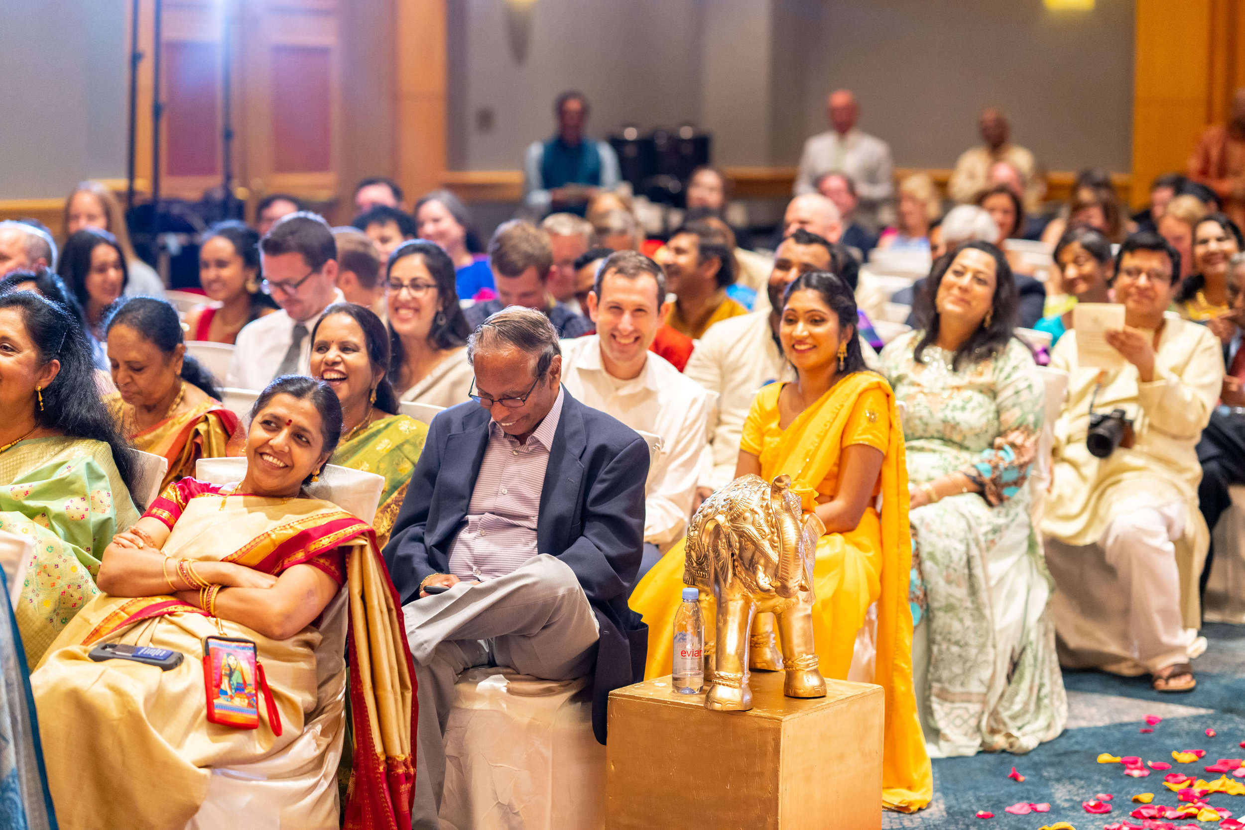 Crowd laughing at bride's vows during indian wedding in dc